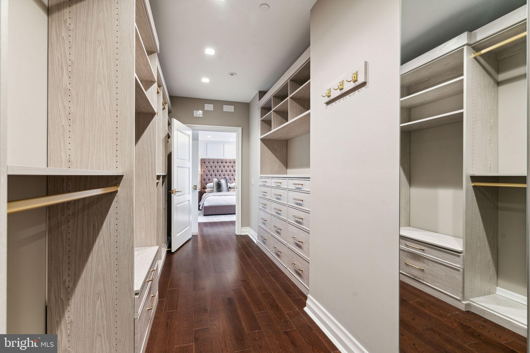1601 Locust Street, Unit 1300 Philadelphia, PA 19102 - Photo 21 of 45 a hallway with wooden floor and staircase