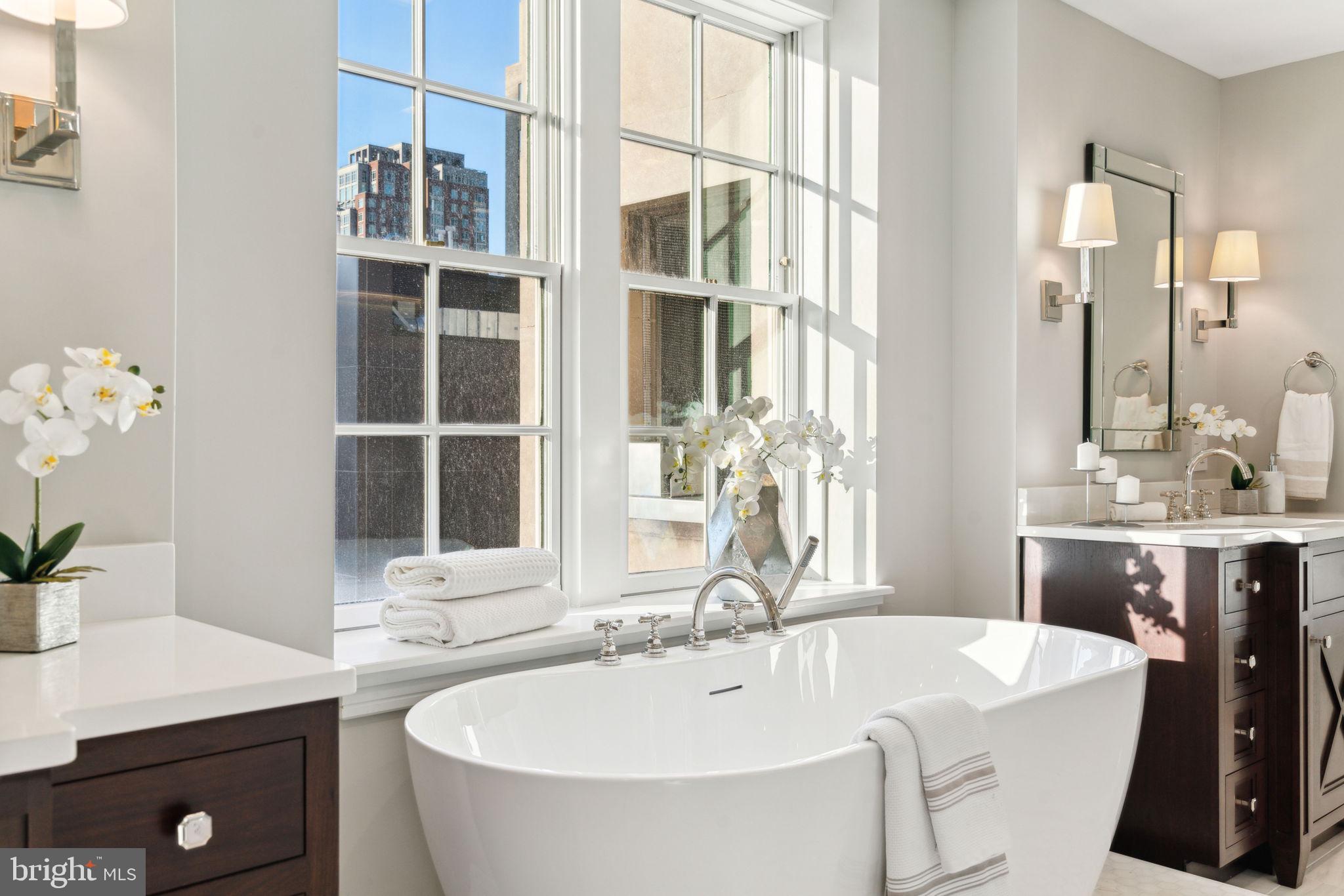 1601 Locust Street, Unit 1300 Philadelphia, PA 19102 - Photo 23 of 45 a bathroom with a tub sink and mirror