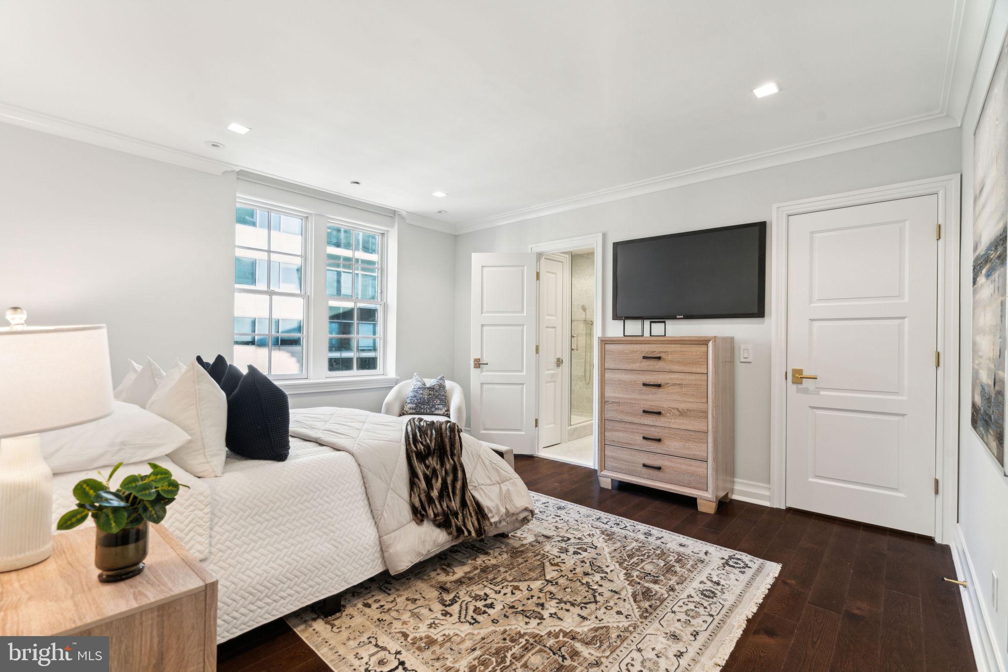 1601 Locust Street, Unit 1300 Philadelphia, PA 19102 - Photo 29 of 45 a bedroom with furniture and flat screen tv