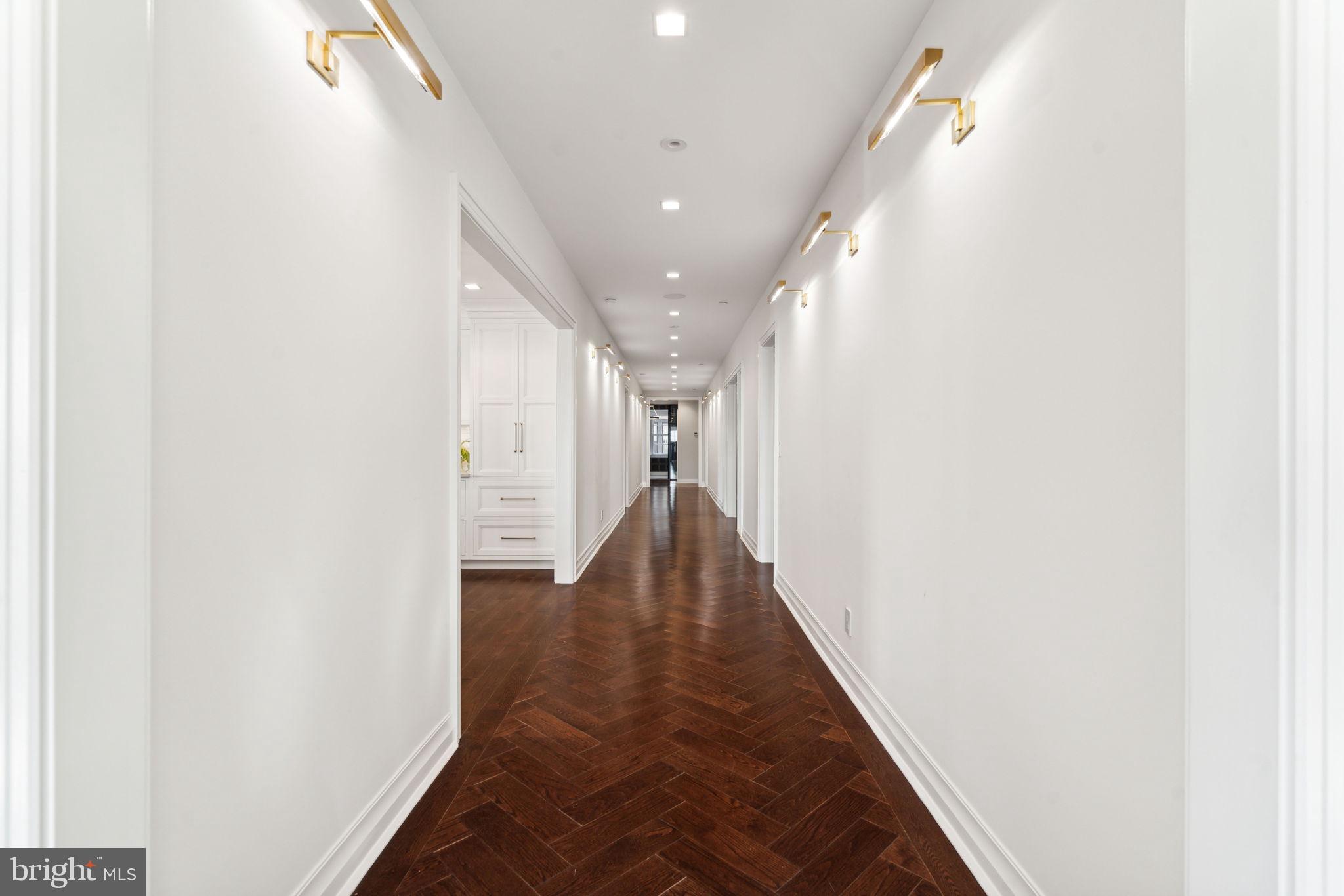 1601 Locust Street, Unit 1300 Philadelphia, PA 19102 - Photo 3 of 45 a view of a hallway with wooden floor