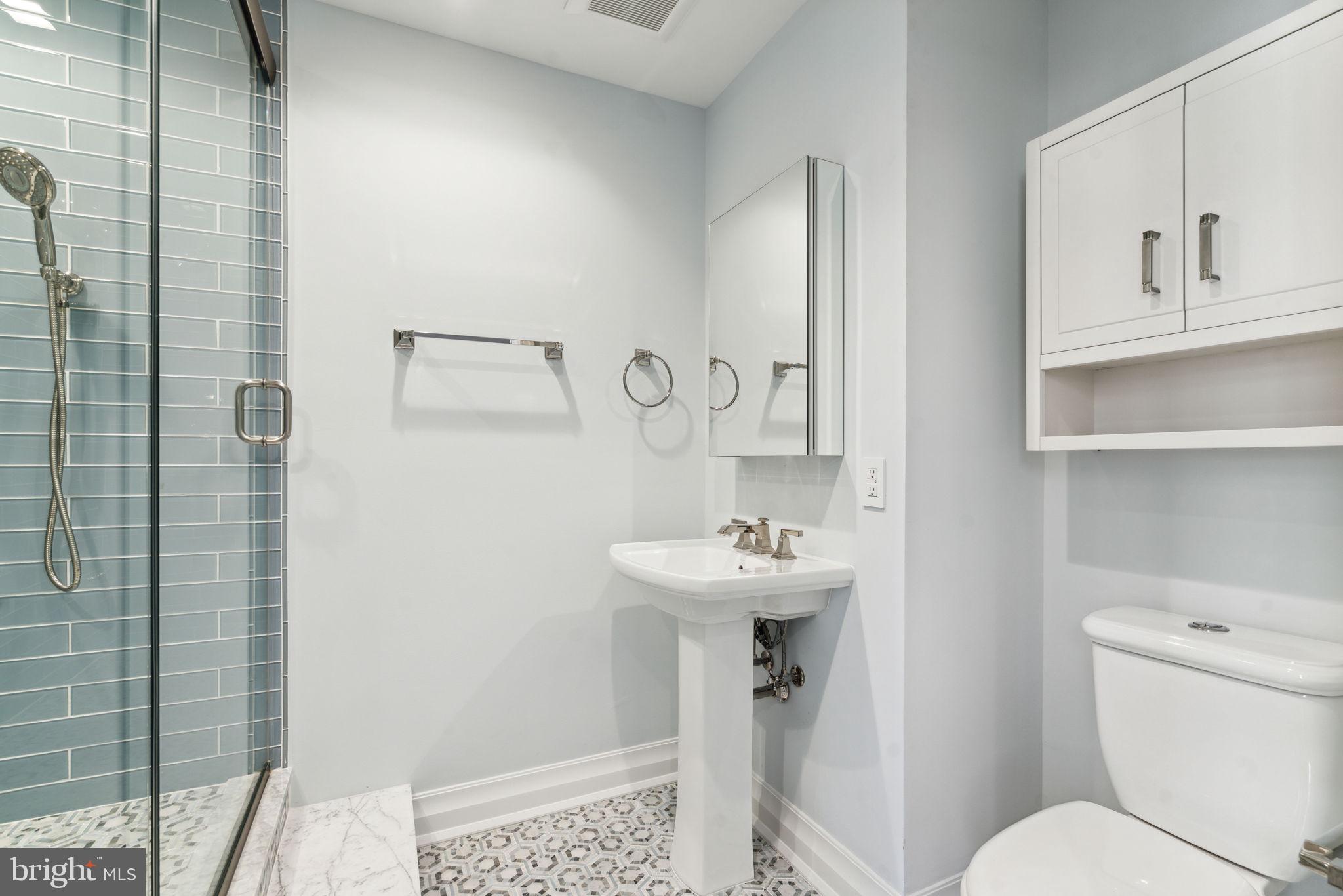 1601 Locust Street, Unit 1300 Philadelphia, PA 19102 - Photo 34 of 45 a bathroom with a sink toilet and shower