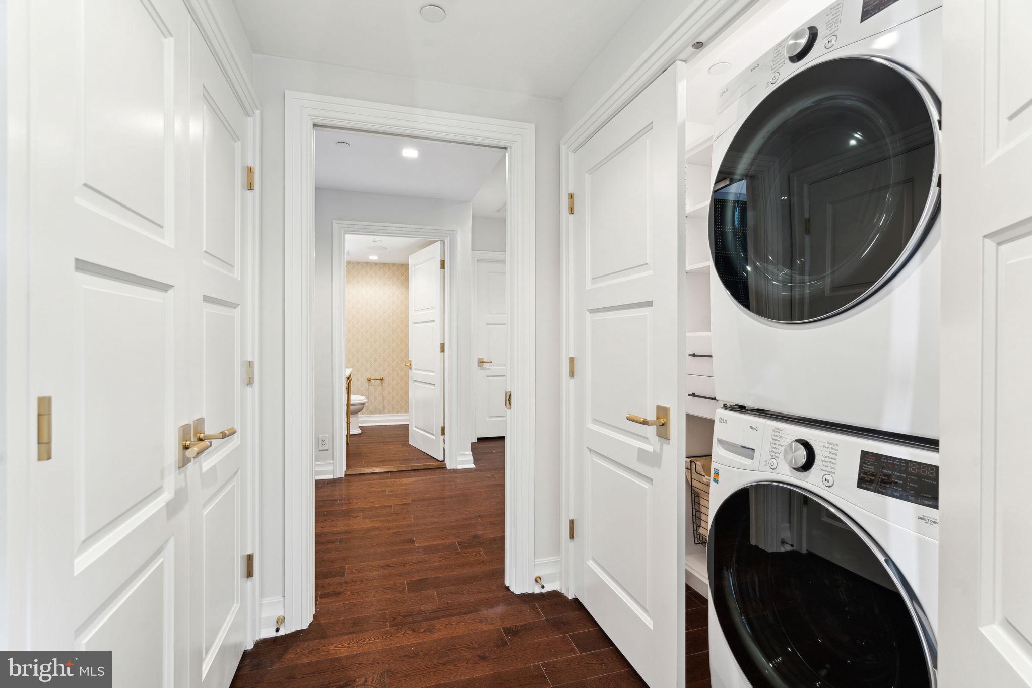 1601 Locust Street, Unit 1300 Philadelphia, PA 19102 - Photo 37 of 45 a view of a hallway with washer and dryer