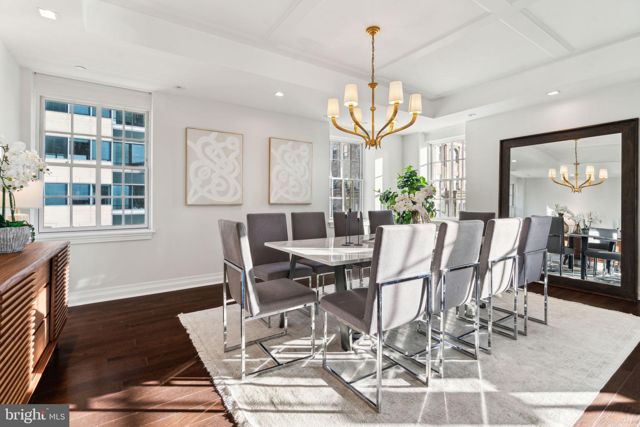 1601 Locust Street, Unit 1300 Philadelphia, PA 19102 - Photo 9 of 45 a view of a dining room with furniture wooden floor and chandelier