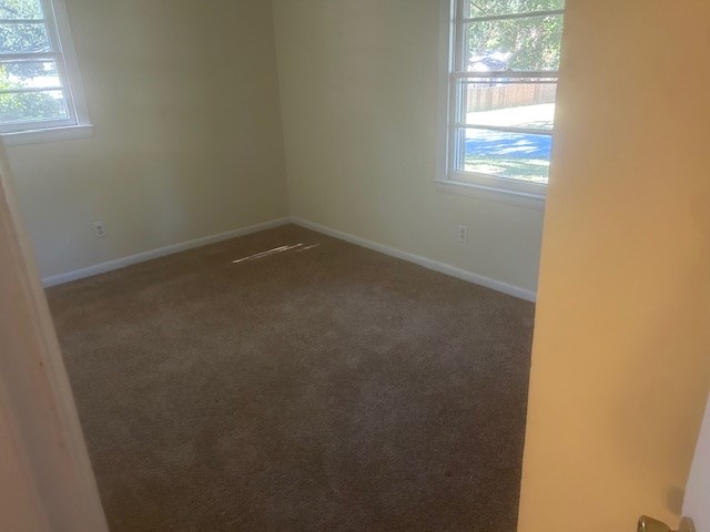 5450 Grumman Avenue Columbus, GA 31909 - Photo 5 of 7 an empty room with windows