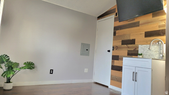 1525 South 400 East, Unit 63 Springville, UT 84663 - Photo 12 of 36 Detailed view of electric panel, wood walls, and wood finished floors