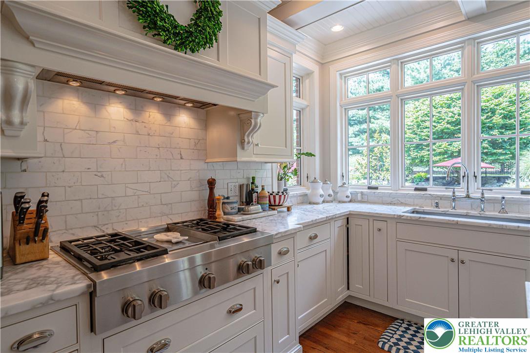 1825 Sherwood Road Allentown, PA 18103 - Photo 23 of 67 a kitchen with a stove and a sink