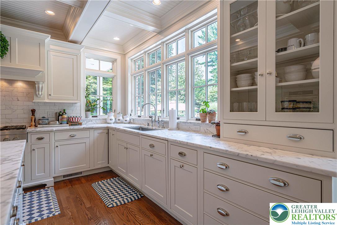 1825 Sherwood Road Allentown, PA 18103 - Photo 24 of 67 a kitchen with a sink window and cabinets