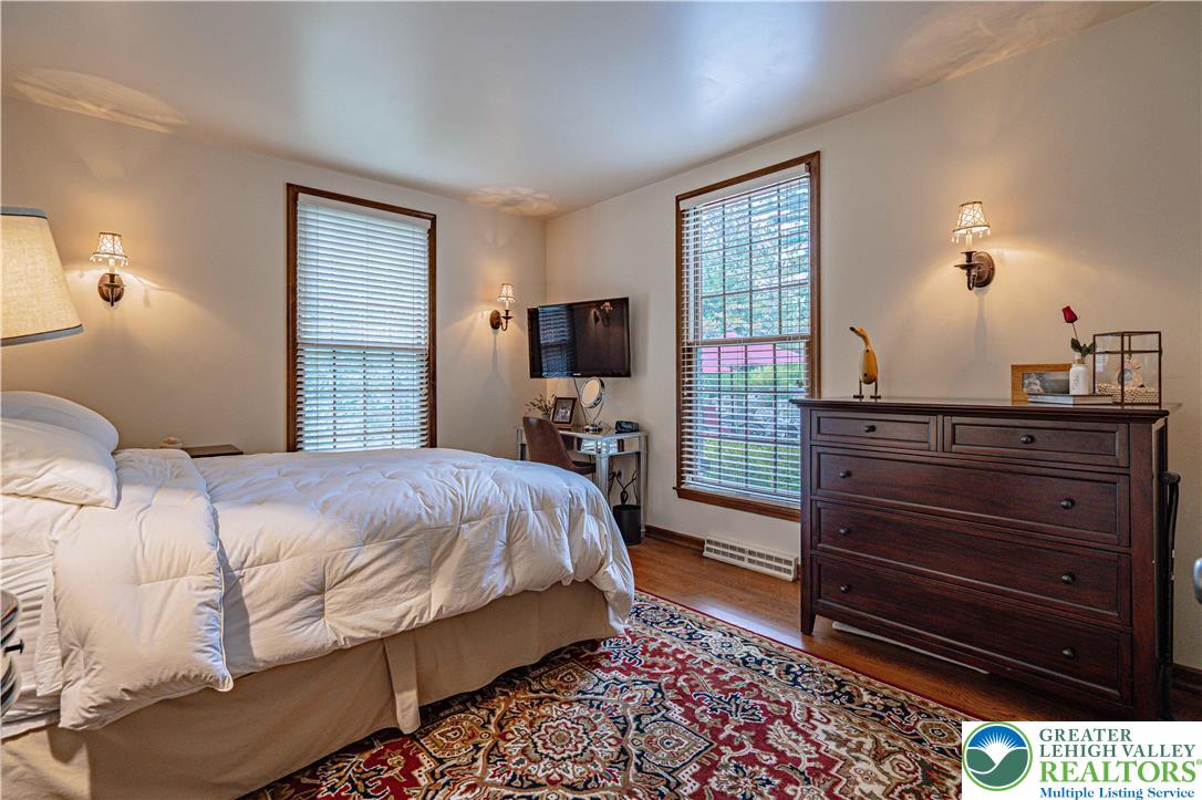 1825 Sherwood Road Allentown, PA 18103 - Photo 36 of 67 a bedroom with a bed and wooden floor