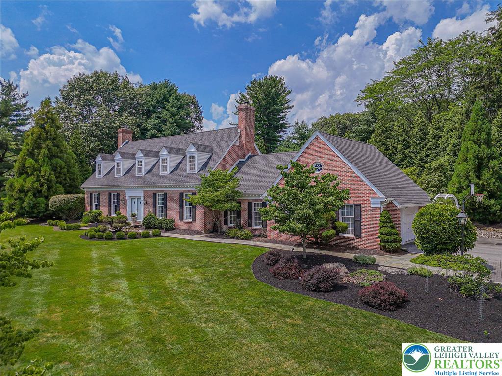 1825 Sherwood Road Allentown, PA 18103 - Photo 4 of 67 a front view of a house with a garden