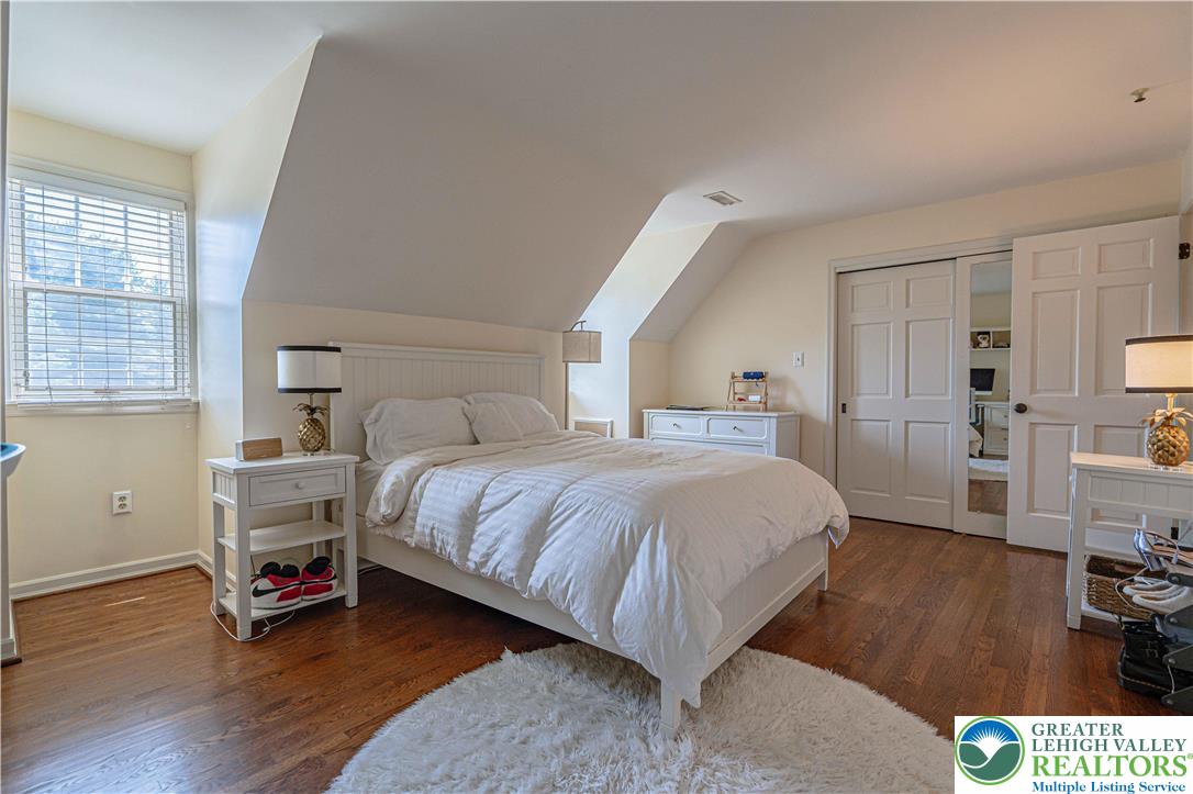 1825 Sherwood Road Allentown, PA 18103 - Photo 46 of 67 a bedroom with a bed and wooden floor