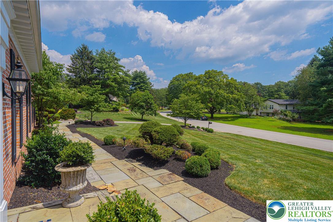 1825 Sherwood Road Allentown, PA 18103 - Photo 8 of 67 a view of a garden with a building in the background