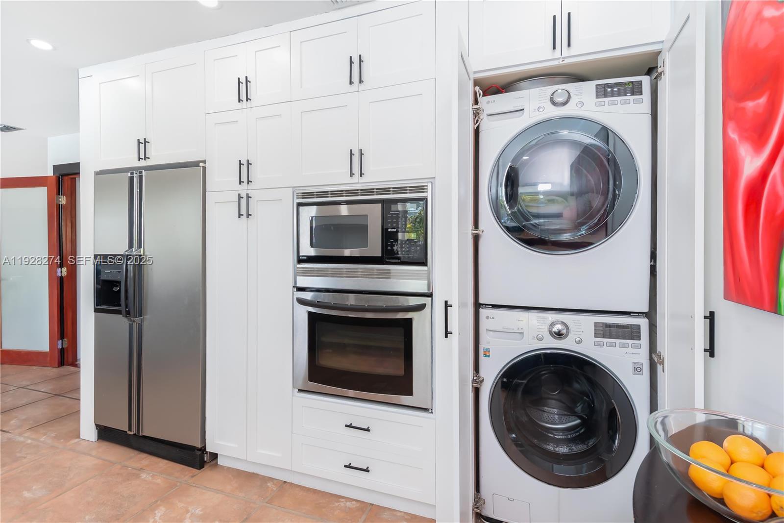 10511 Southwest 122nd Court Miami, FL 33186 - Photo 14 of 36 a close up view of a washer and dryer in a kitchen