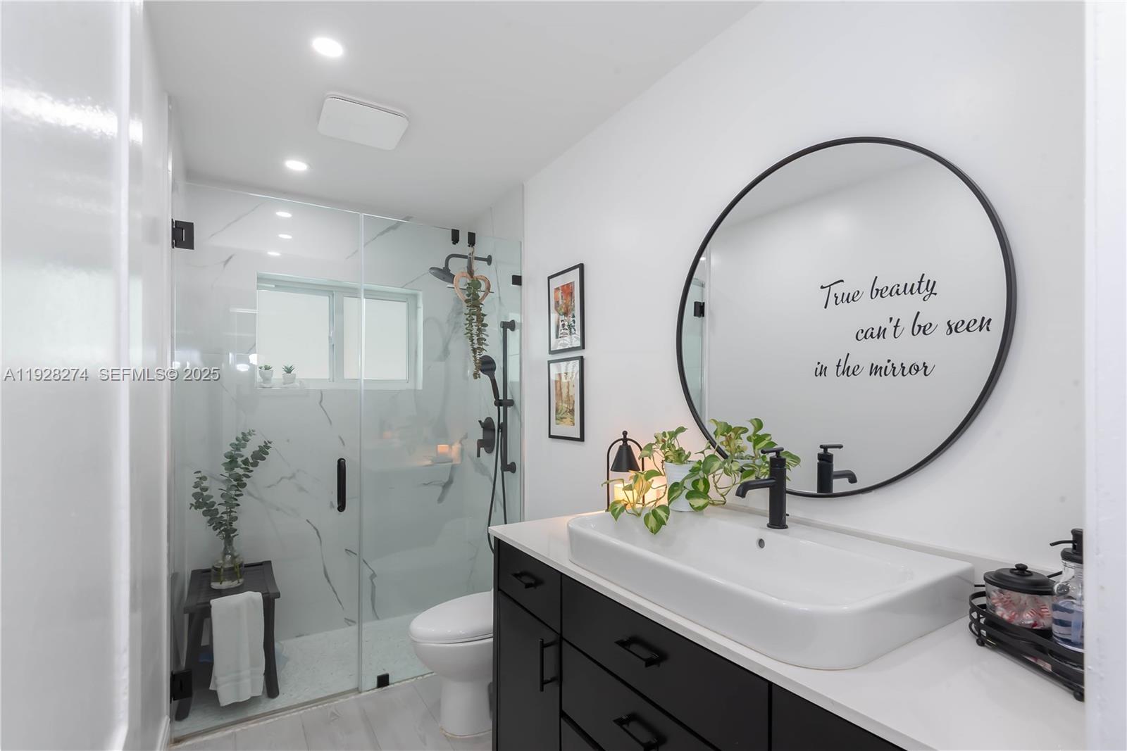 10511 Southwest 122nd Court Miami, FL 33186 - Photo 20 of 36 a bathroom with a sink mirror toilet and shower