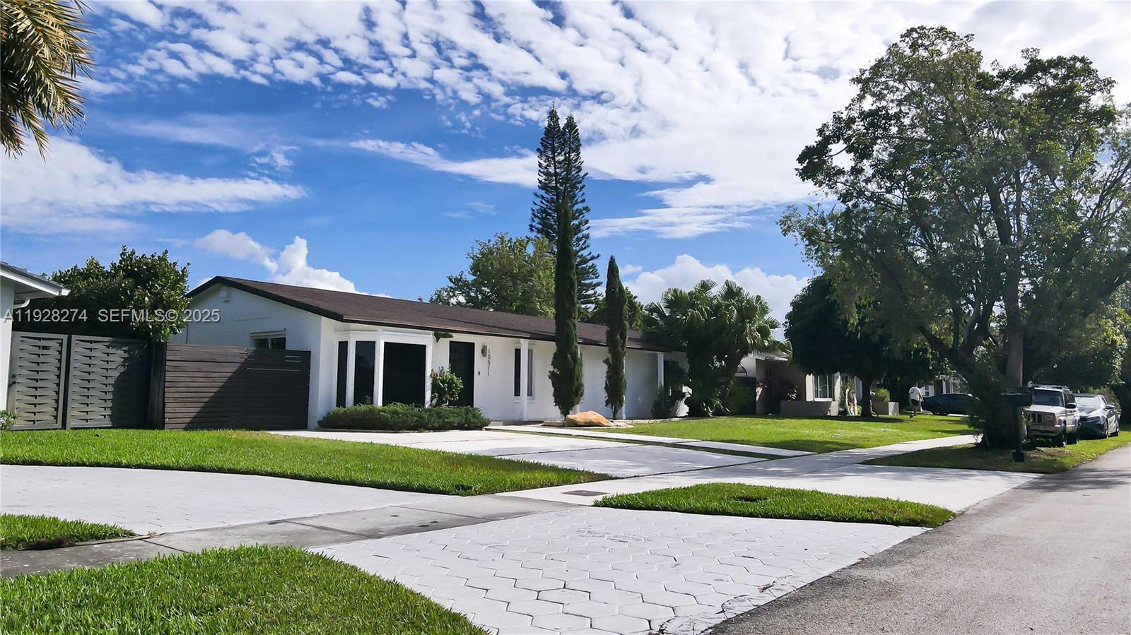 10511 Southwest 122nd Court Miami, FL 33186 - Photo 2 of 36 a front view of a house with a yard