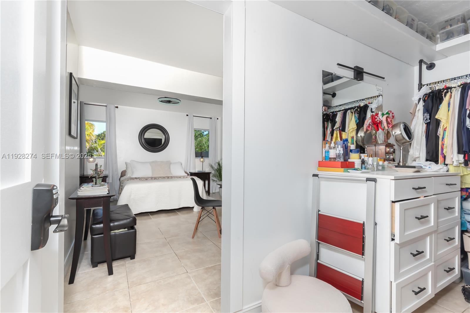 10511 Southwest 122nd Court Miami, FL 33186 - Photo 23 of 36 a living room with furniture and a flat screen tv