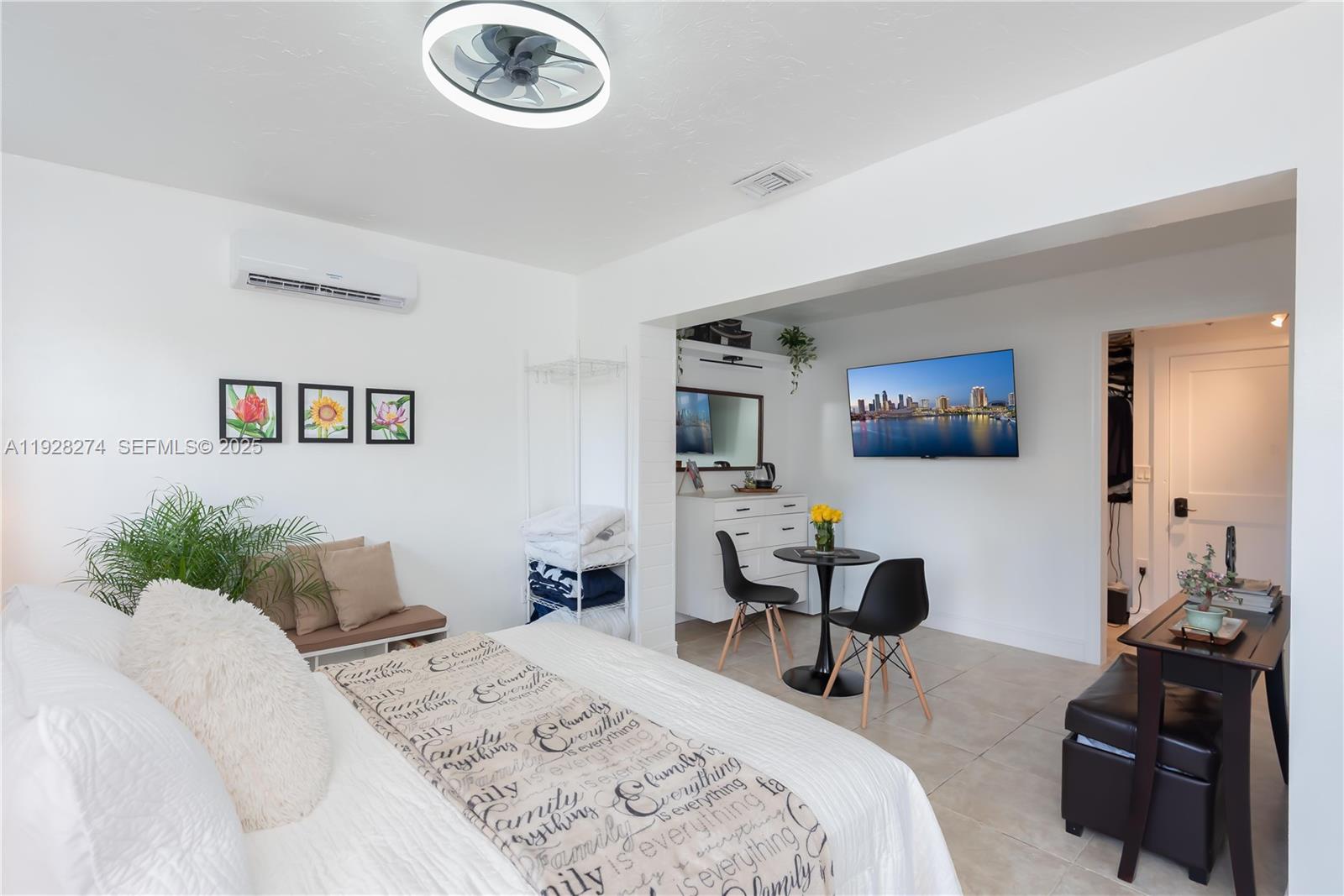 10511 Southwest 122nd Court Miami, FL 33186 - Photo 26 of 36 a bedroom with a bed couch and view kitchen