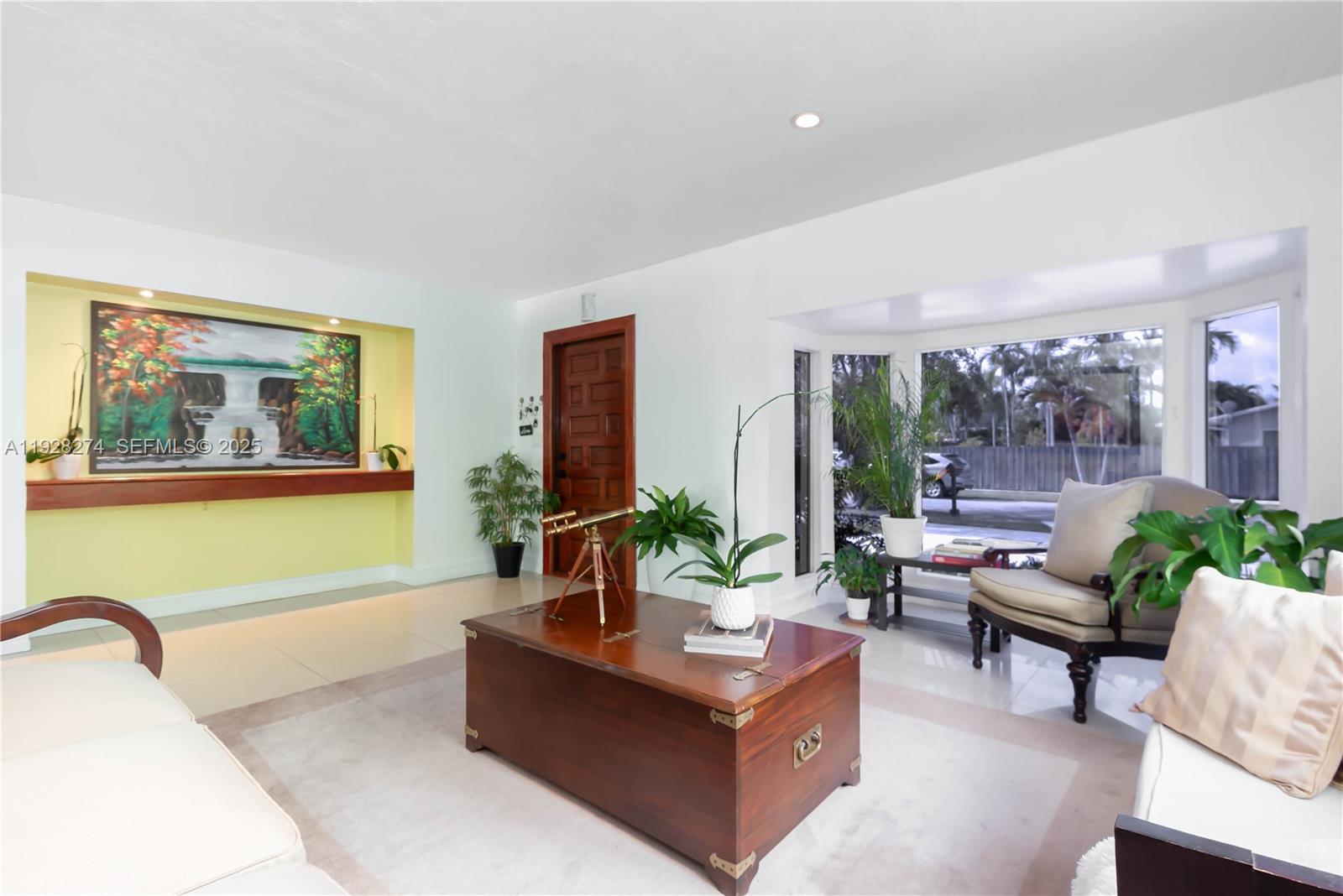 10511 Southwest 122nd Court Miami, FL 33186 - Photo 9 of 36 a living room with furniture and a large window
