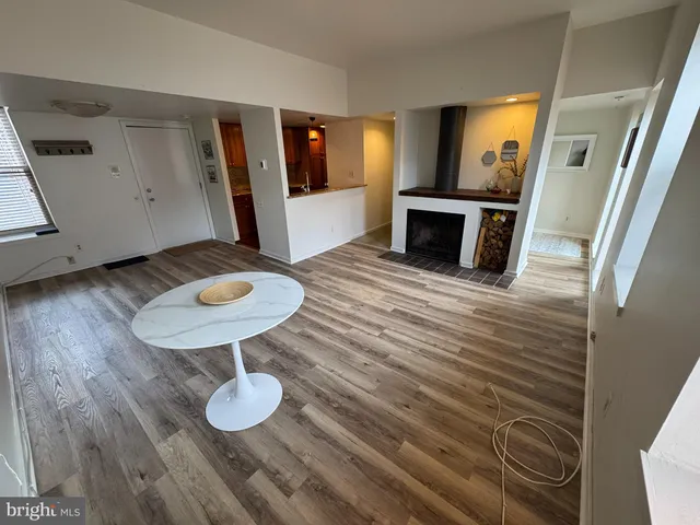 a view of a livingroom with furniture and a fireplace