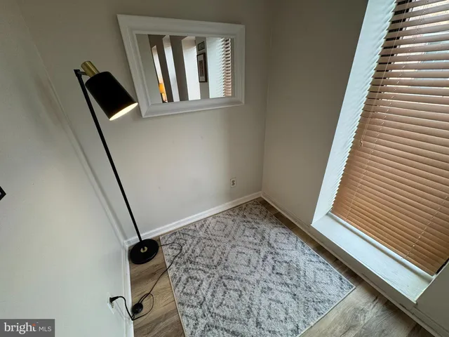 a view of an empty room and staircase