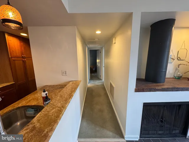 a bathroom with a tub and a sink