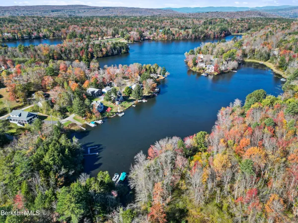 an aerial view of a house with a lake view