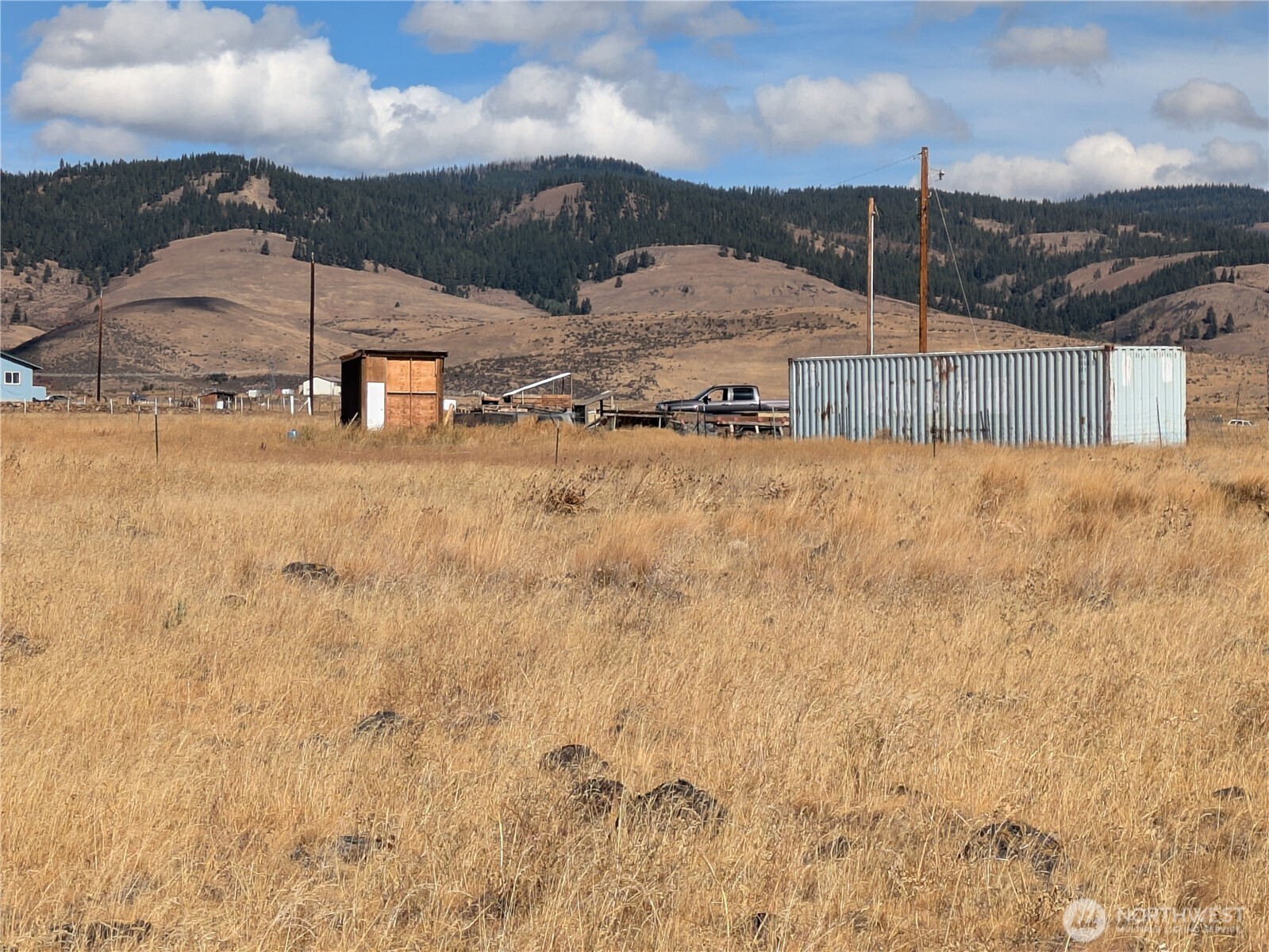 1151 Flying Rock Road Ellensburg, WA 98926 - Photo 5 of 18 a view of a dry yard with wooden fence