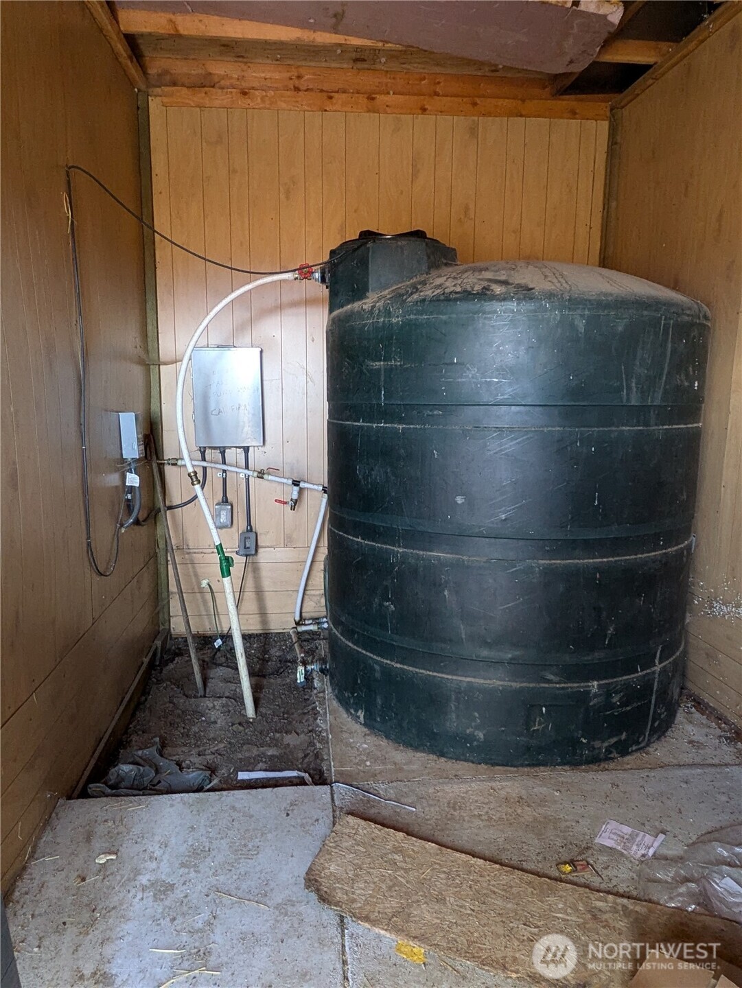 1151 Flying Rock Road Ellensburg, WA 98926 - Photo 9 of 18 a room with water heater and wooden floor