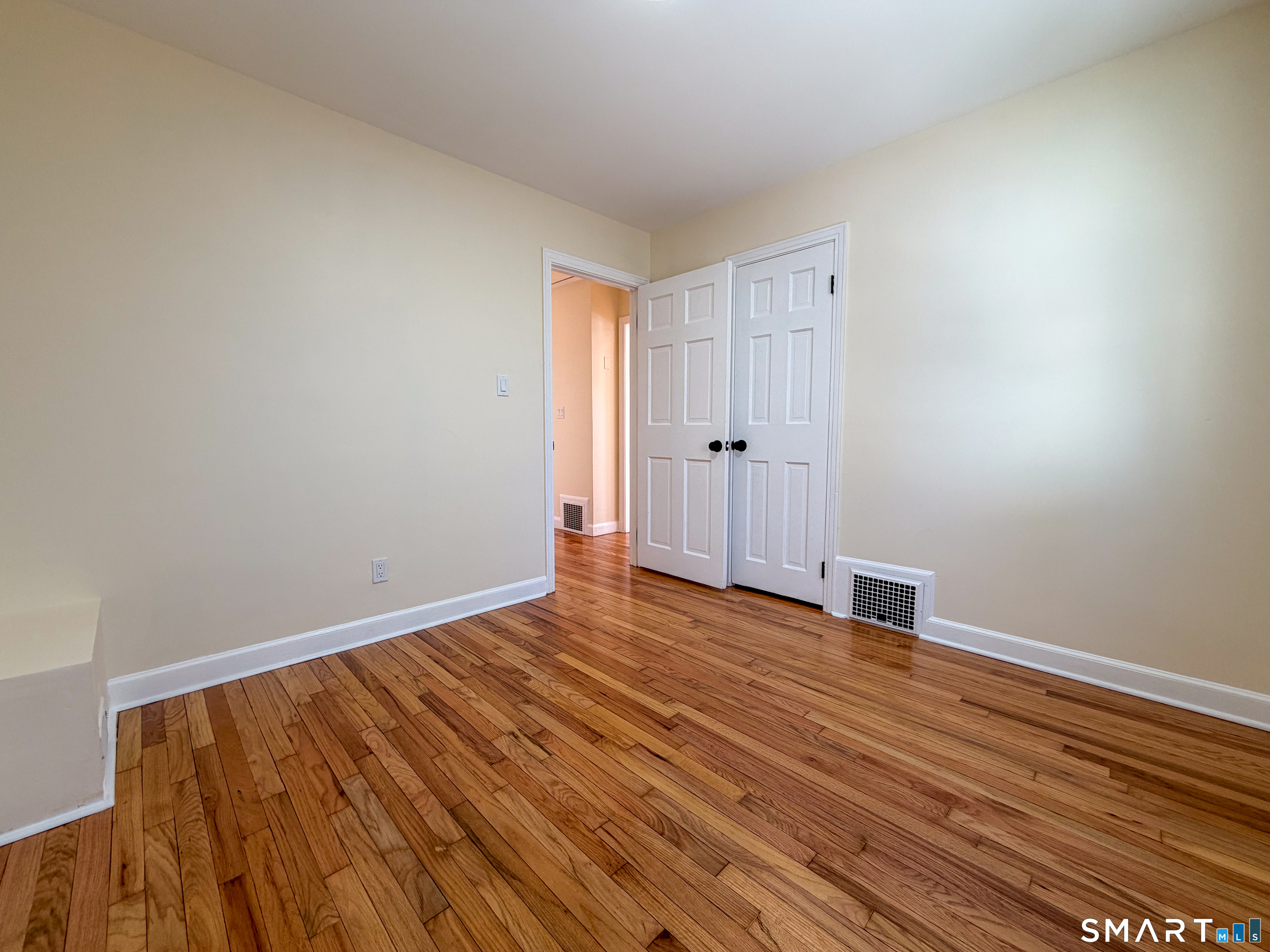 48 Rockwood Road Hamden, CT 06514 - Photo 13 of 17 a view of an empty room with wooden floor
