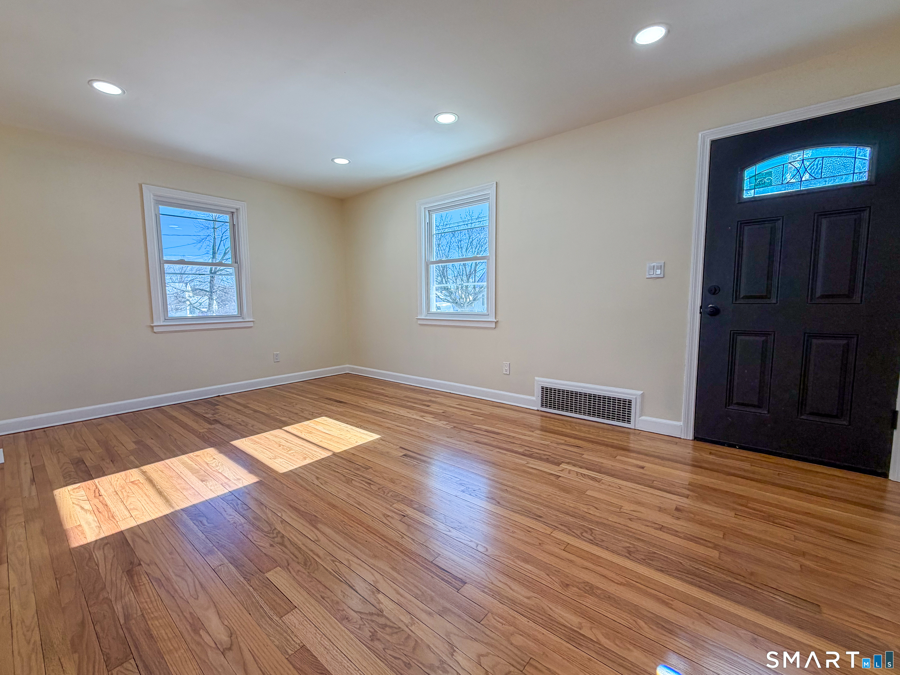 48 Rockwood Road Hamden, CT 06514 - Photo 2 of 17 wooden floor in an empty room with a window
