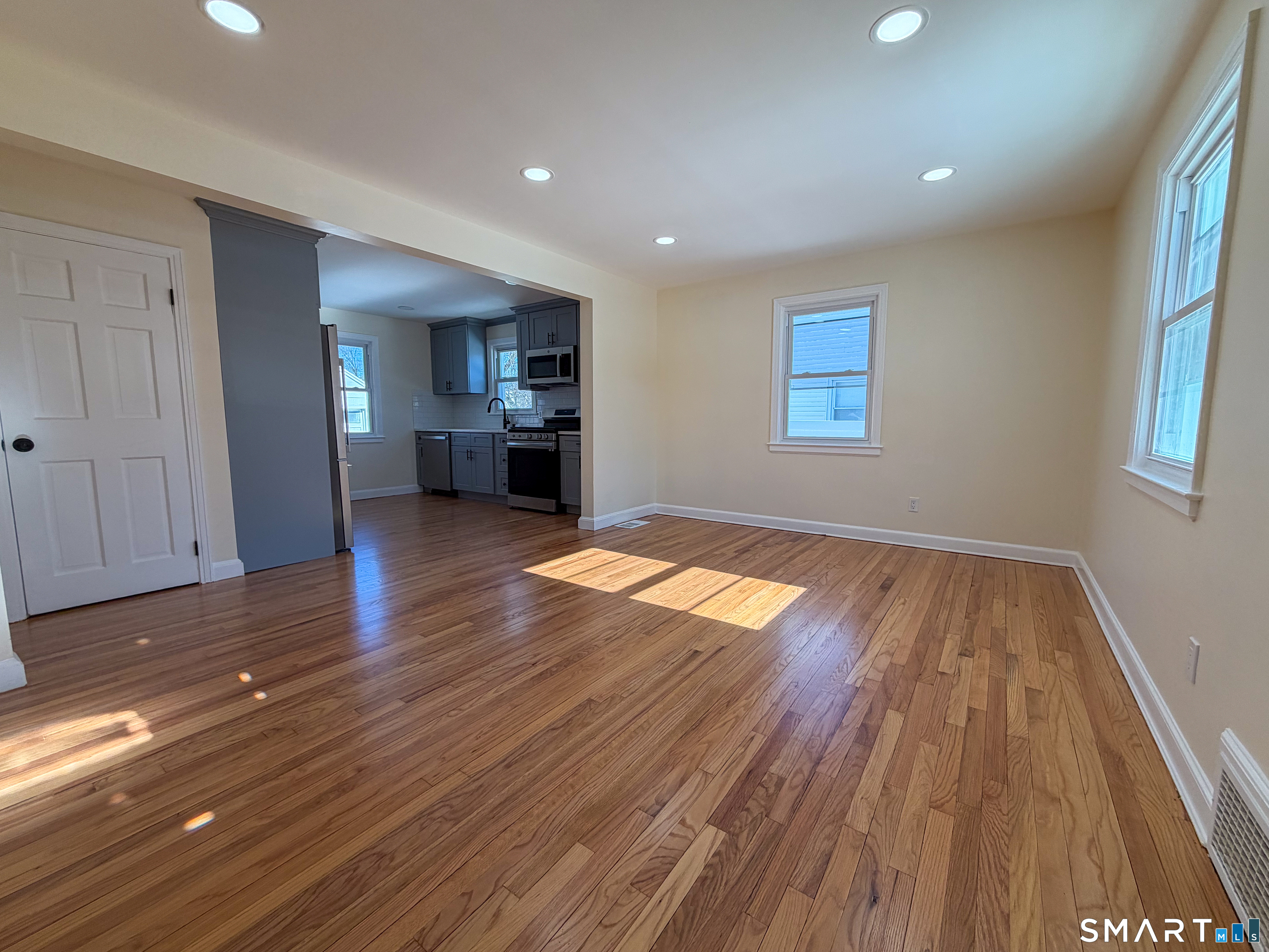 48 Rockwood Road Hamden, CT 06514 - Photo 3 of 17 wooden floor in an empty room with a window