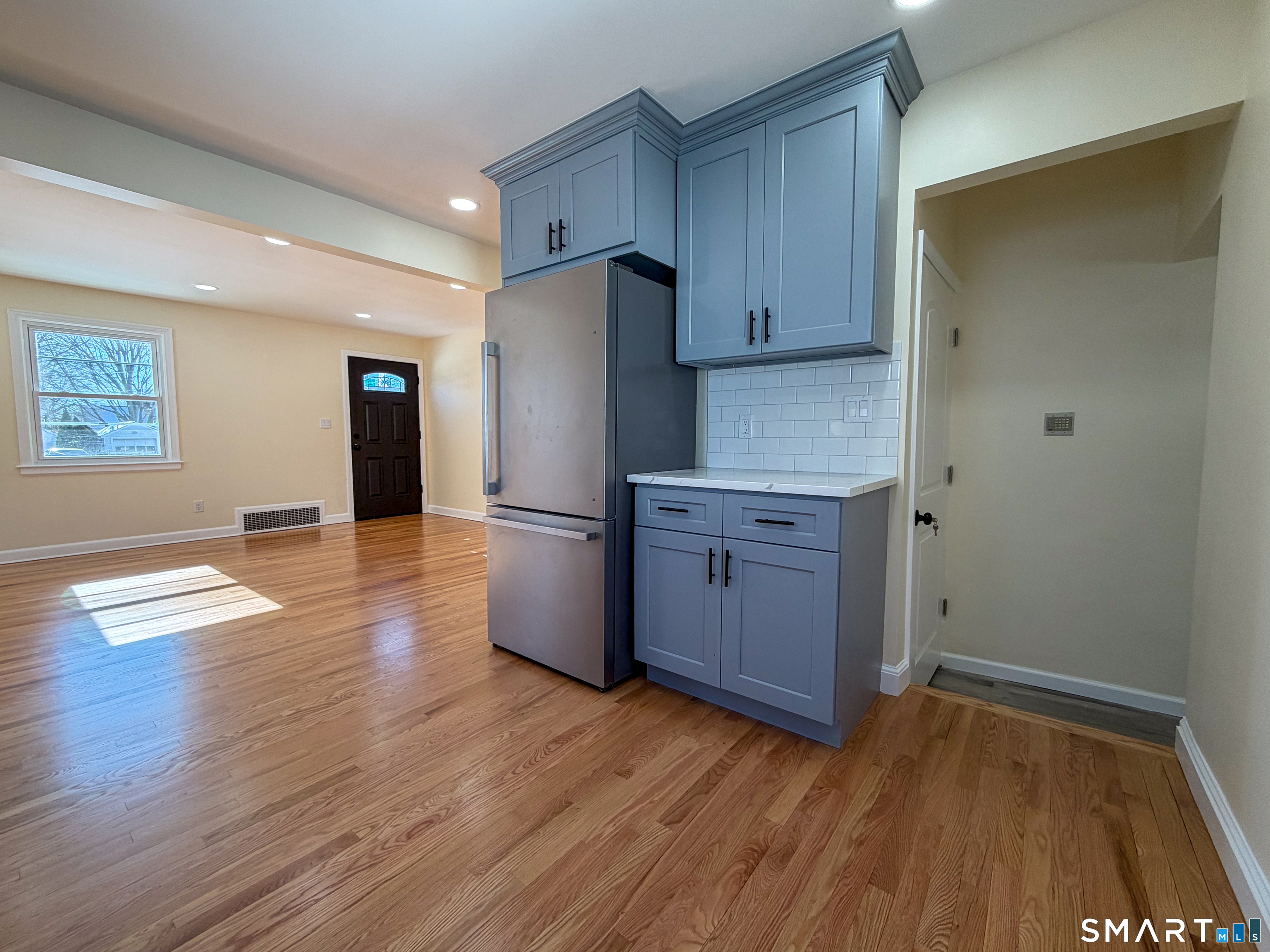 48 Rockwood Road Hamden, CT 06514 - Photo 5 of 17 a kitchen with a refrigerator and a stove top oven