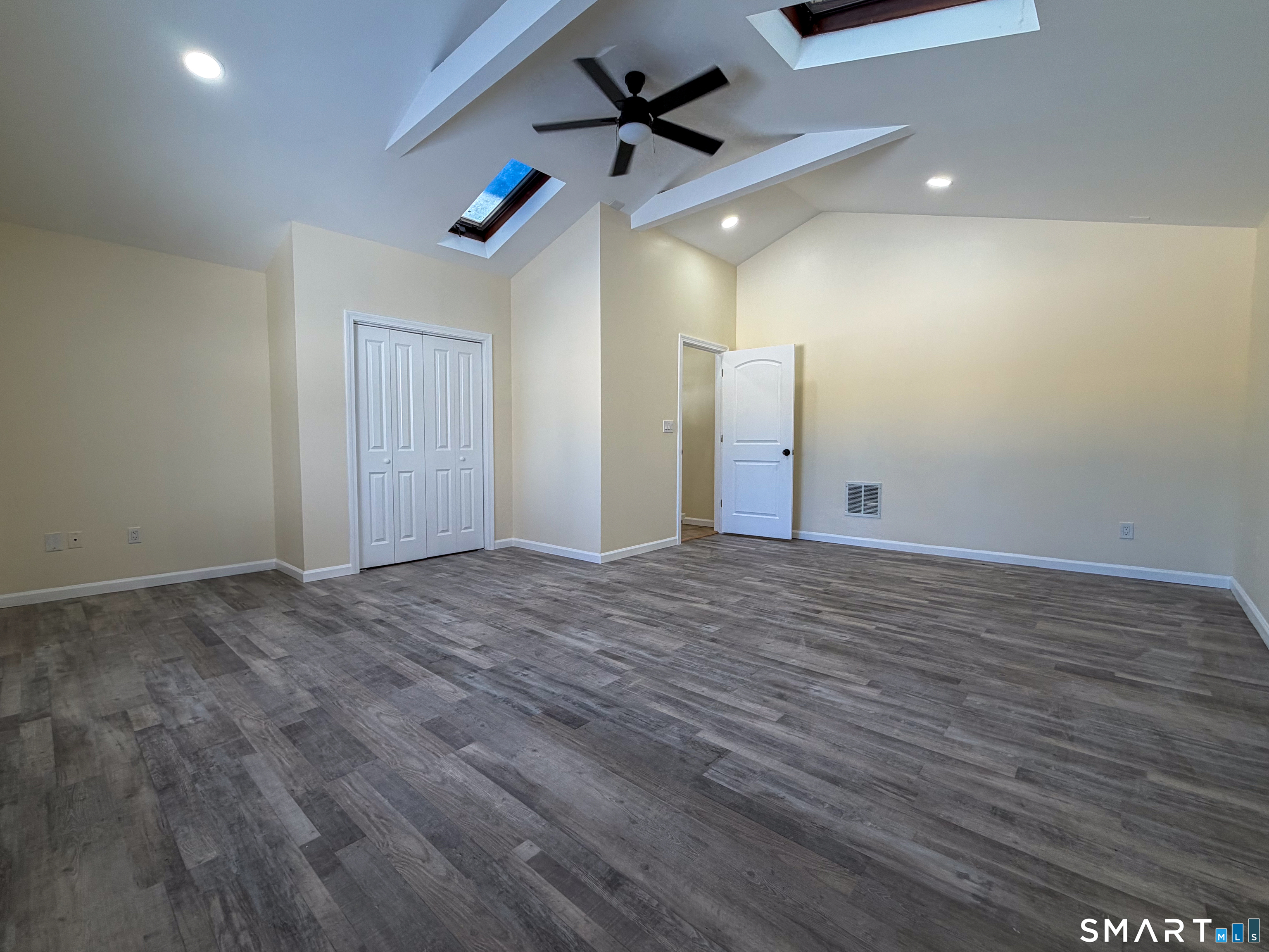 48 Rockwood Road Hamden, CT 06514 - Photo 8 of 17 an empty room with ceiling fan and wooden floor
