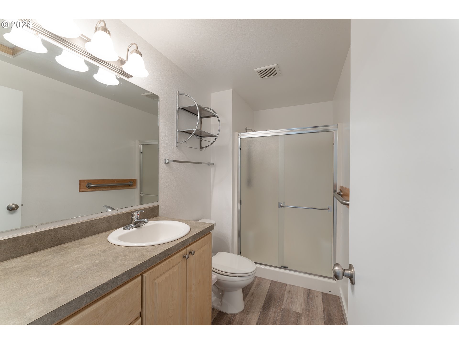 510 Reston Road Tenmile, OR 97481 - Photo 12 of 36 a bathroom with a sink toilet a mirror and shower