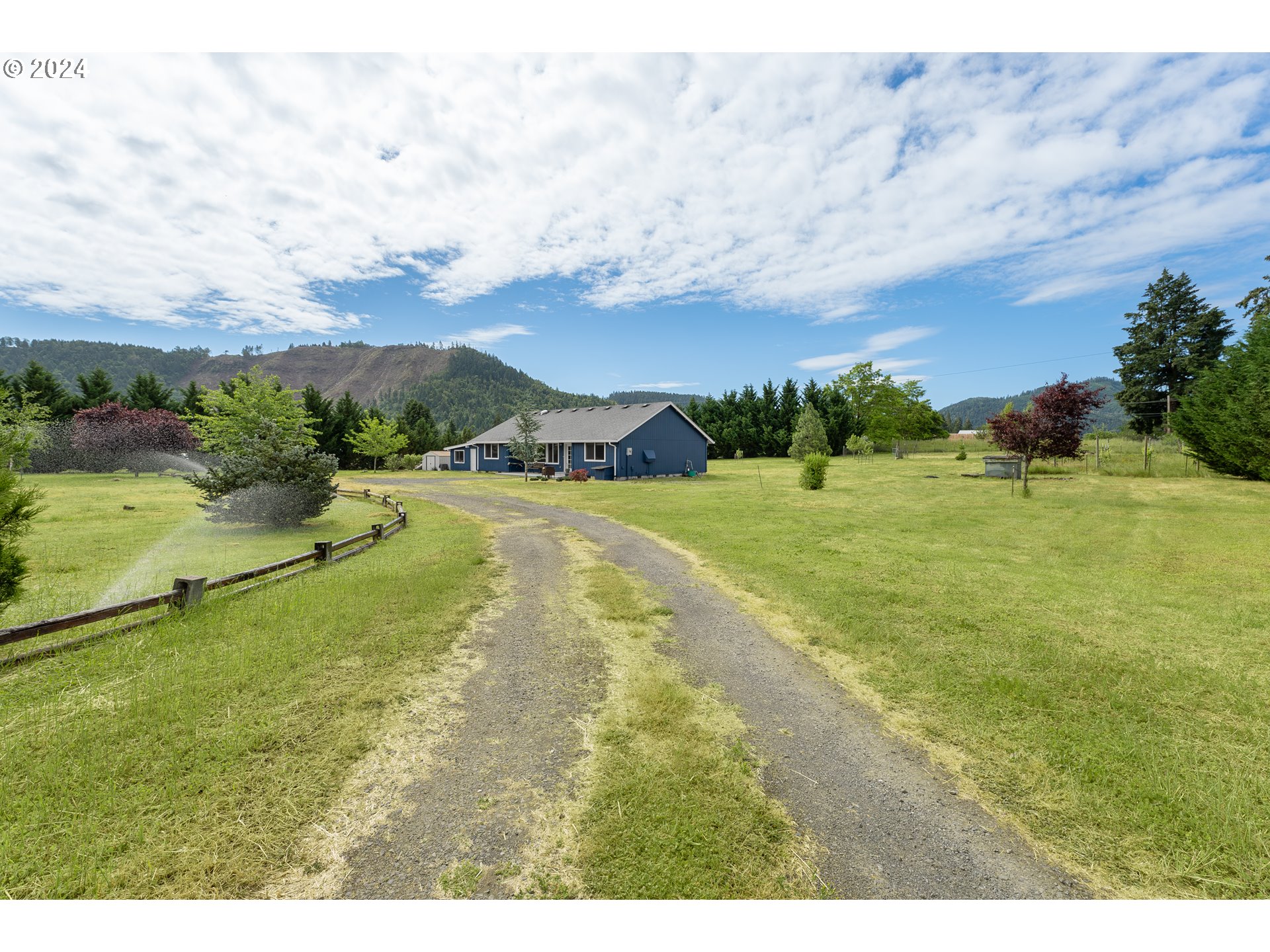 510 Reston Road Tenmile, OR 97481 - Photo 2 of 36 a view of a lake with a yard