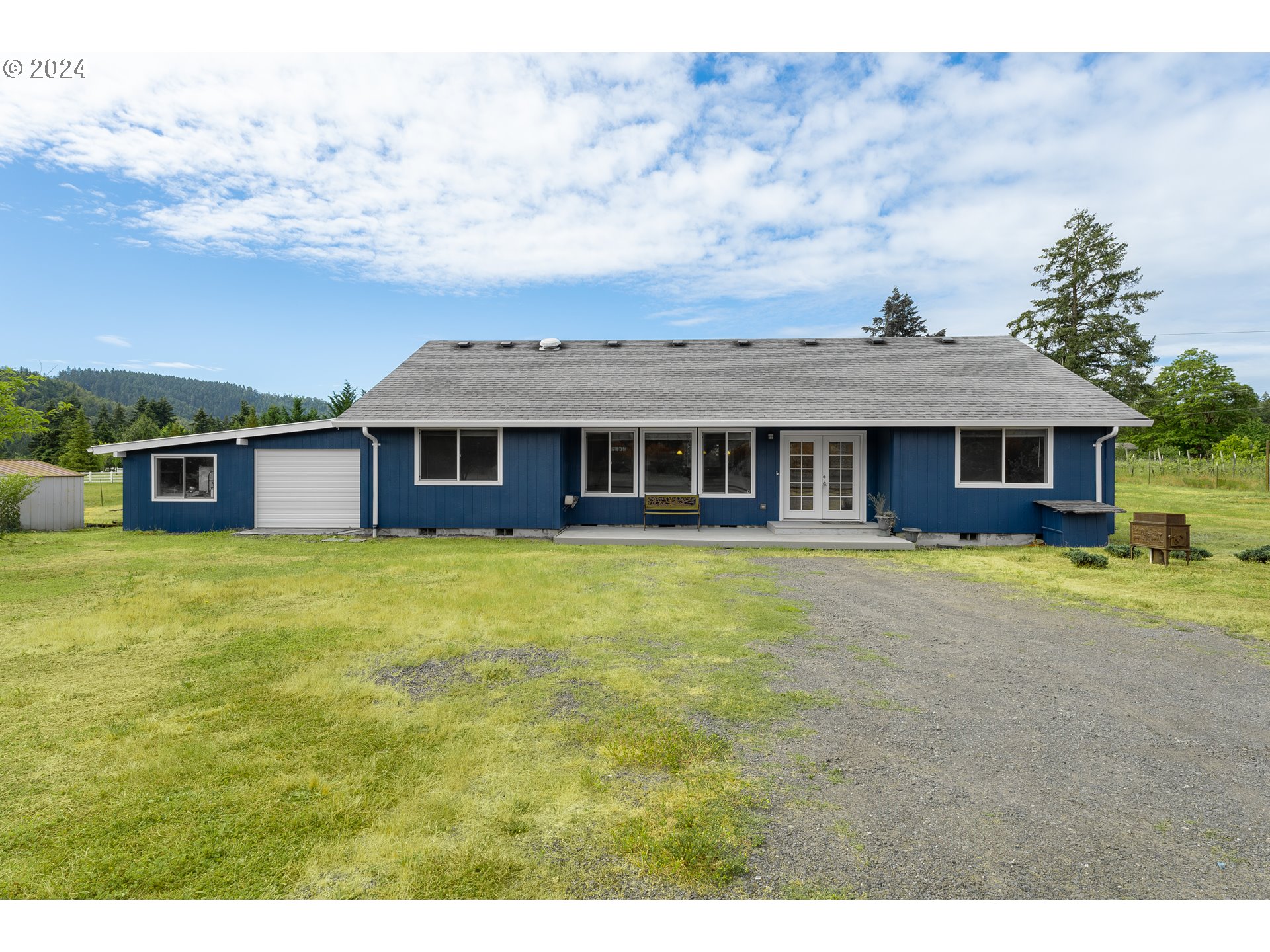 510 Reston Road Tenmile, OR 97481 - Photo 3 of 36 a front view of a house with a garden