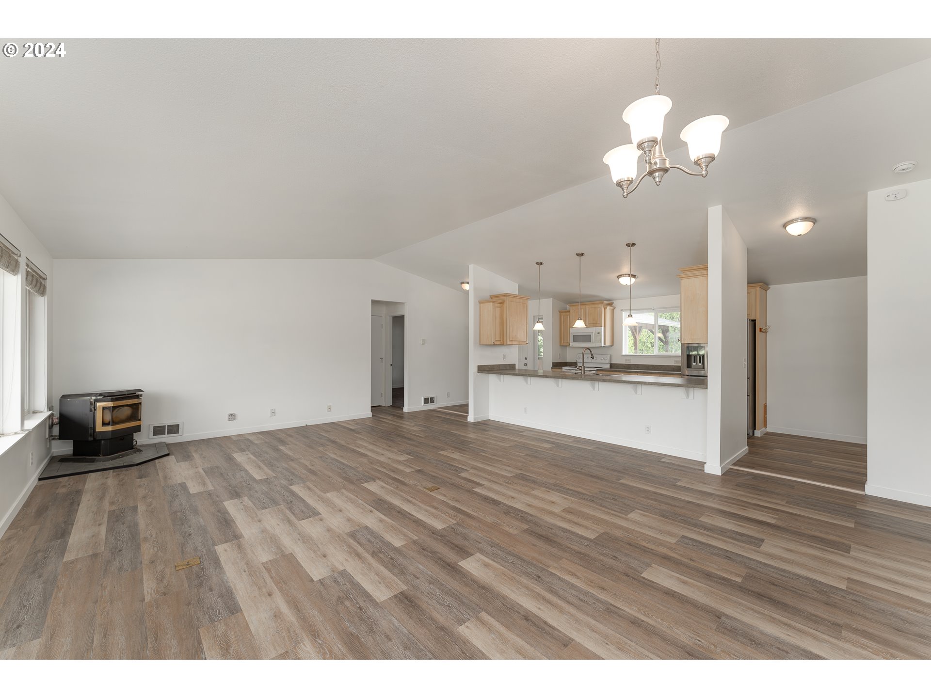 510 Reston Road Tenmile, OR 97481 - Photo 4 of 36 a view of a room with a chandelier