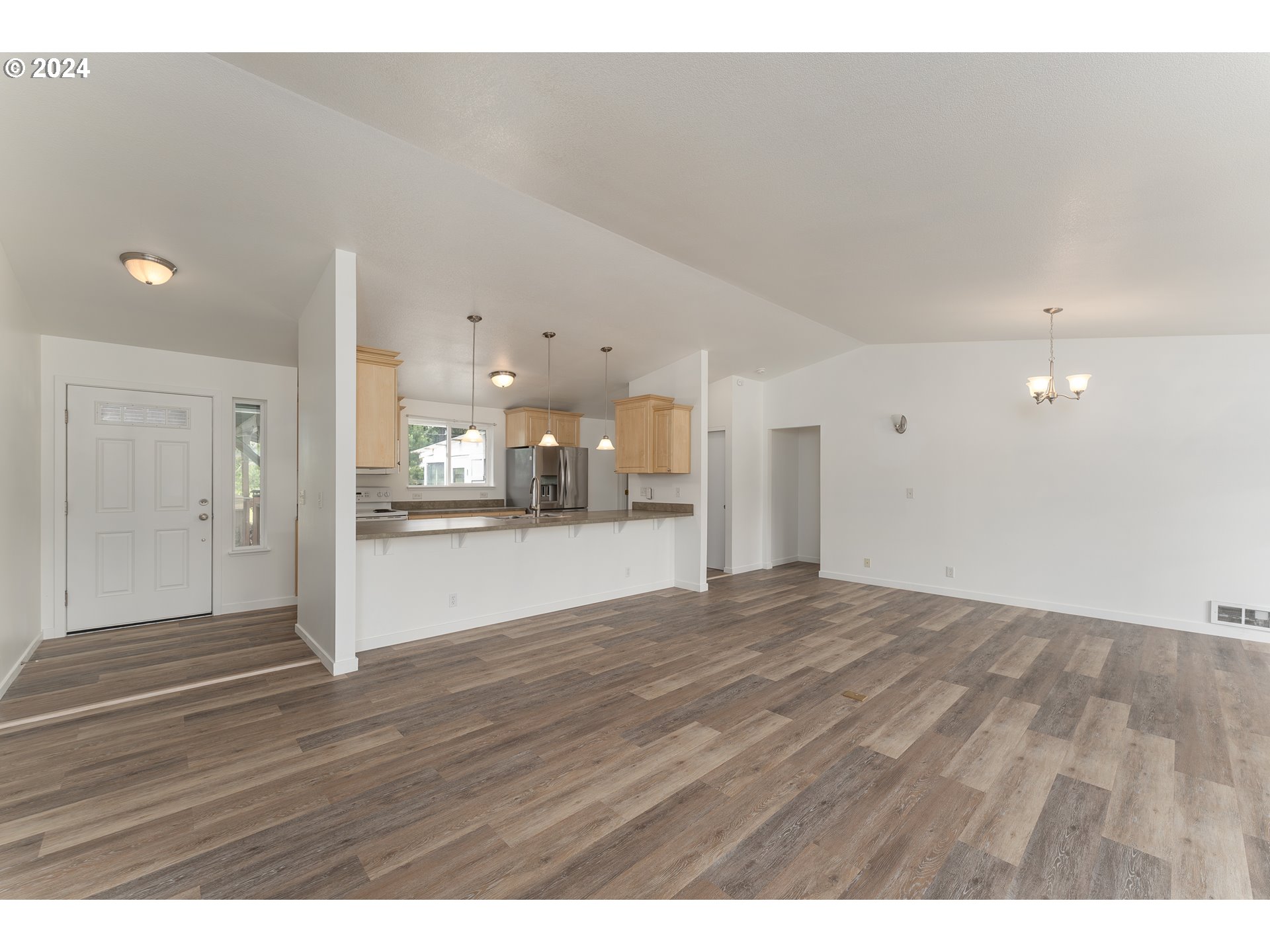 510 Reston Road Tenmile, OR 97481 - Photo 5 of 36 a view of empty room with wooden floor
