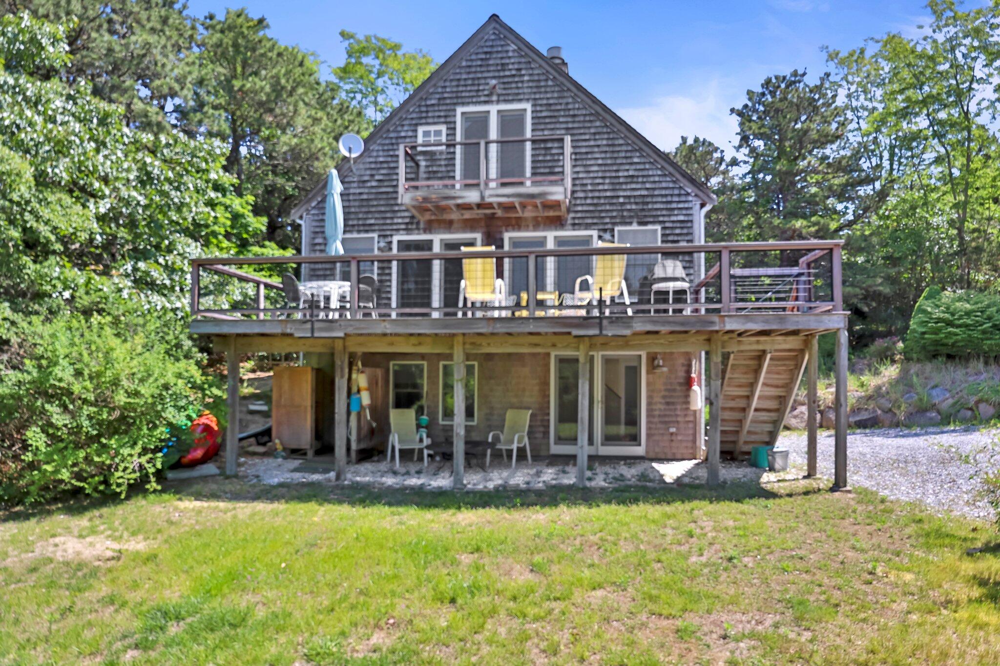 112 Castle Road Truro, MA 02666 - Photo 1 of 43 a front view of a house with swimming pool