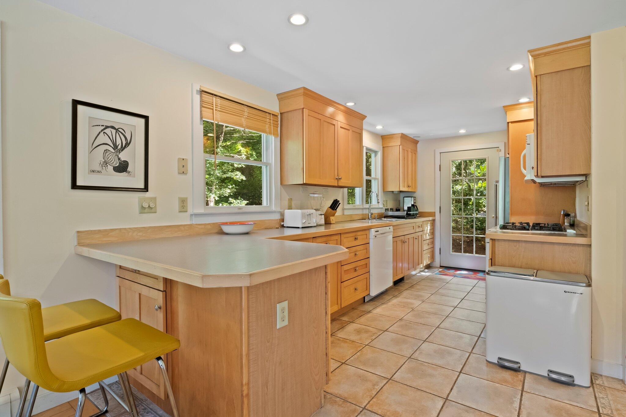 112 Castle Road Truro, MA 02666 - Photo 13 of 43 a kitchen with a sink cabinets and window