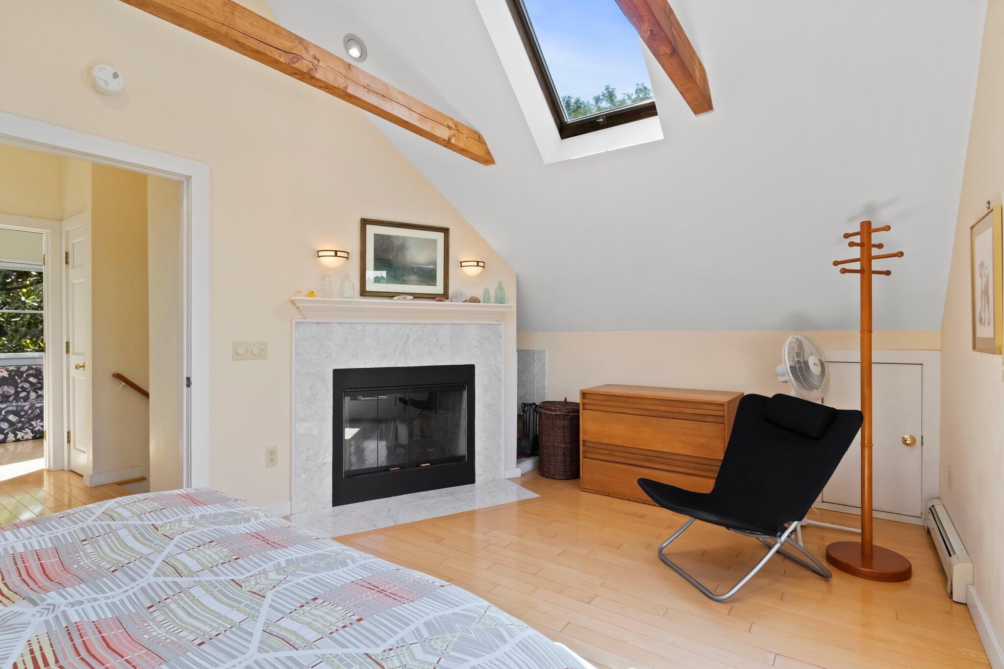 112 Castle Road Truro, MA 02666 - Photo 23 of 43 a living room with furniture and a fireplace