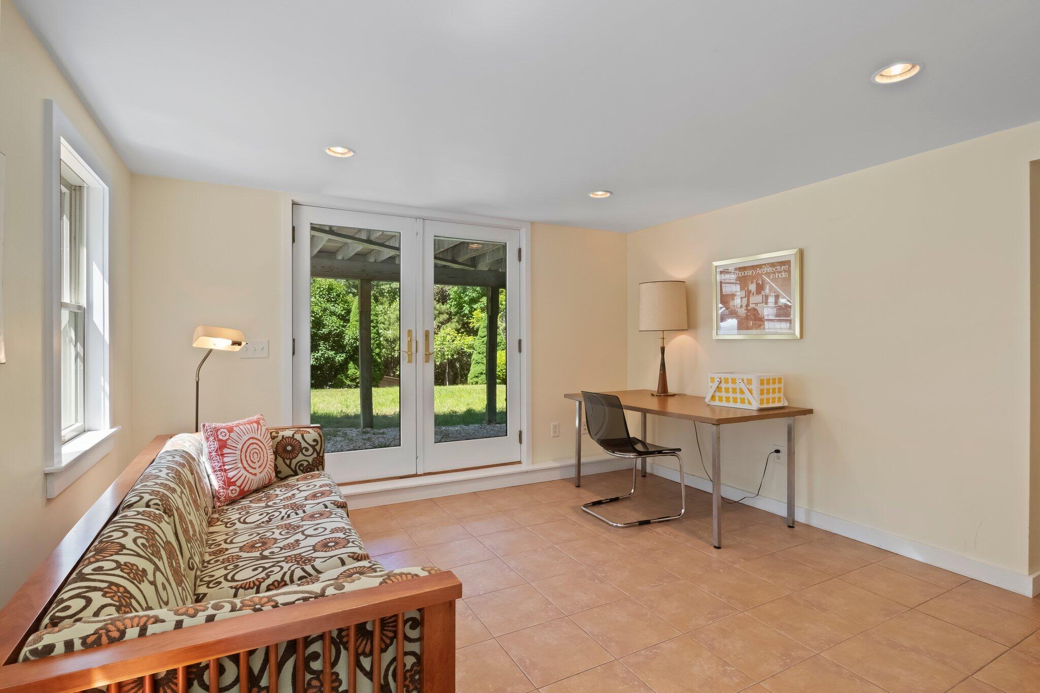 112 Castle Road Truro, MA 02666 - Photo 28 of 43 a living room with furniture and a large window