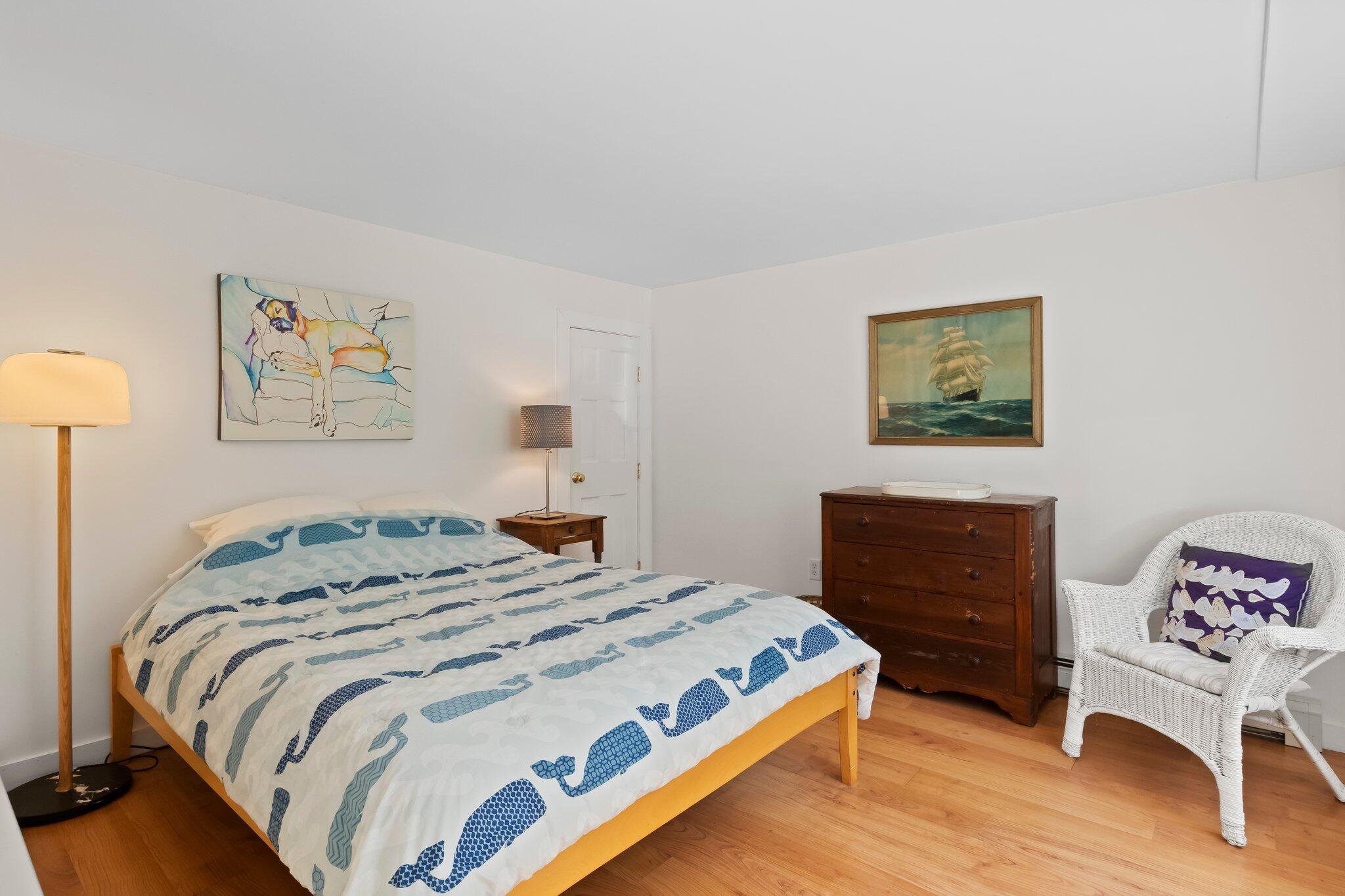 112 Castle Road Truro, MA 02666 - Photo 30 of 43 a bedroom with a bed and a dresser