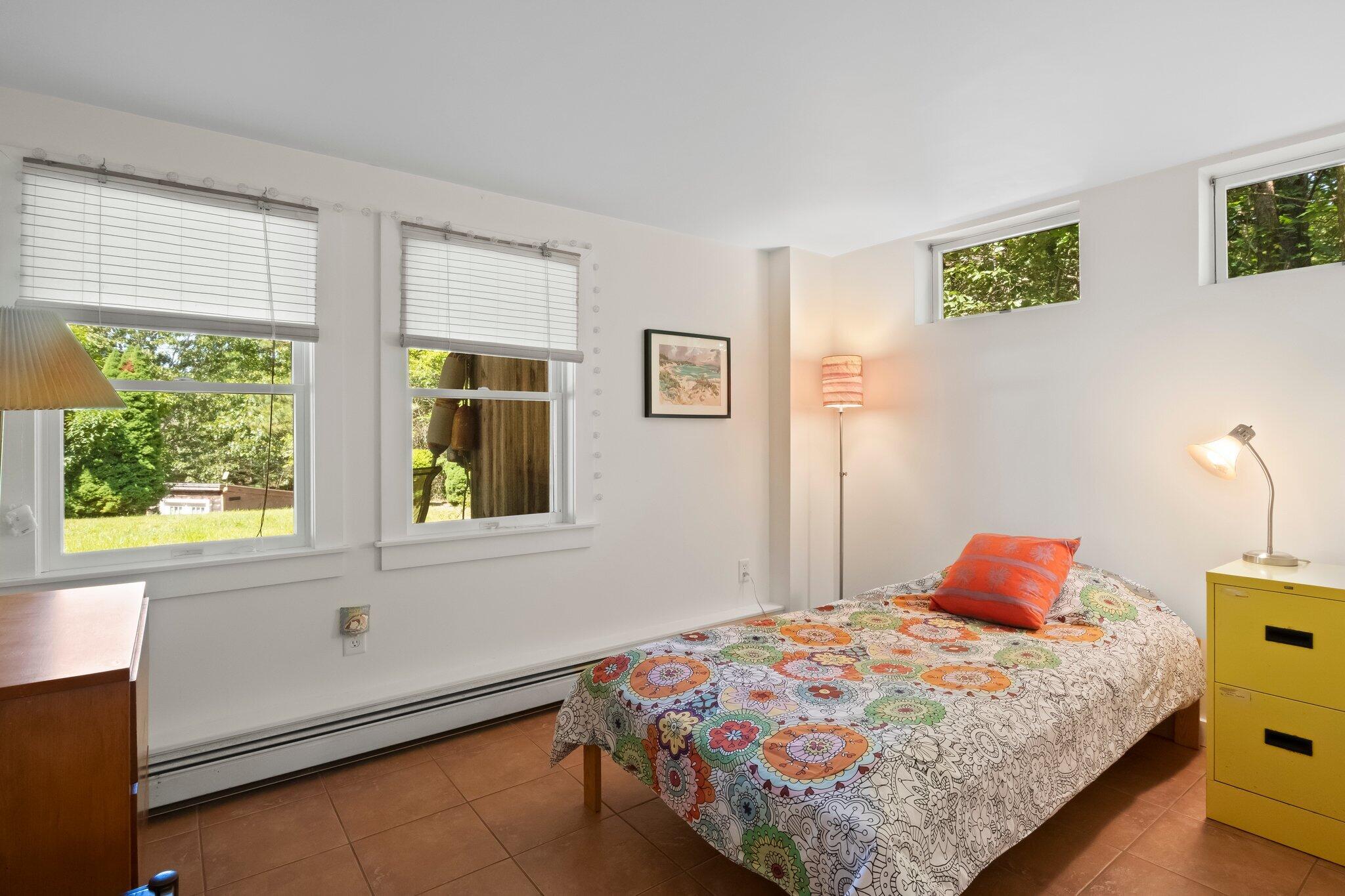 112 Castle Road Truro, MA 02666 - Photo 32 of 43 a bedroom with a bed and window