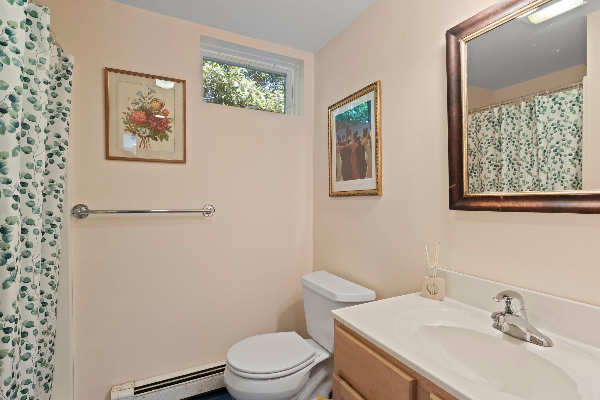 112 Castle Road Truro, MA 02666 - Photo 34 of 43 a white toilet sitting next to a bathroom sink