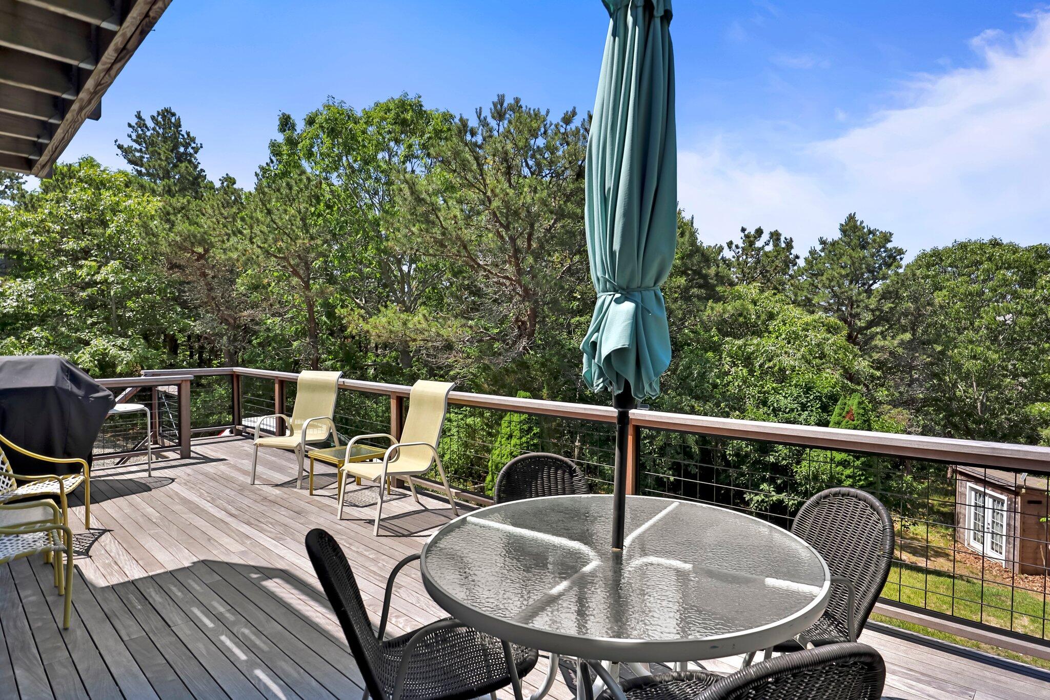 112 Castle Road Truro, MA 02666 - Photo 5 of 43 a view of a balcony with a table and chairs