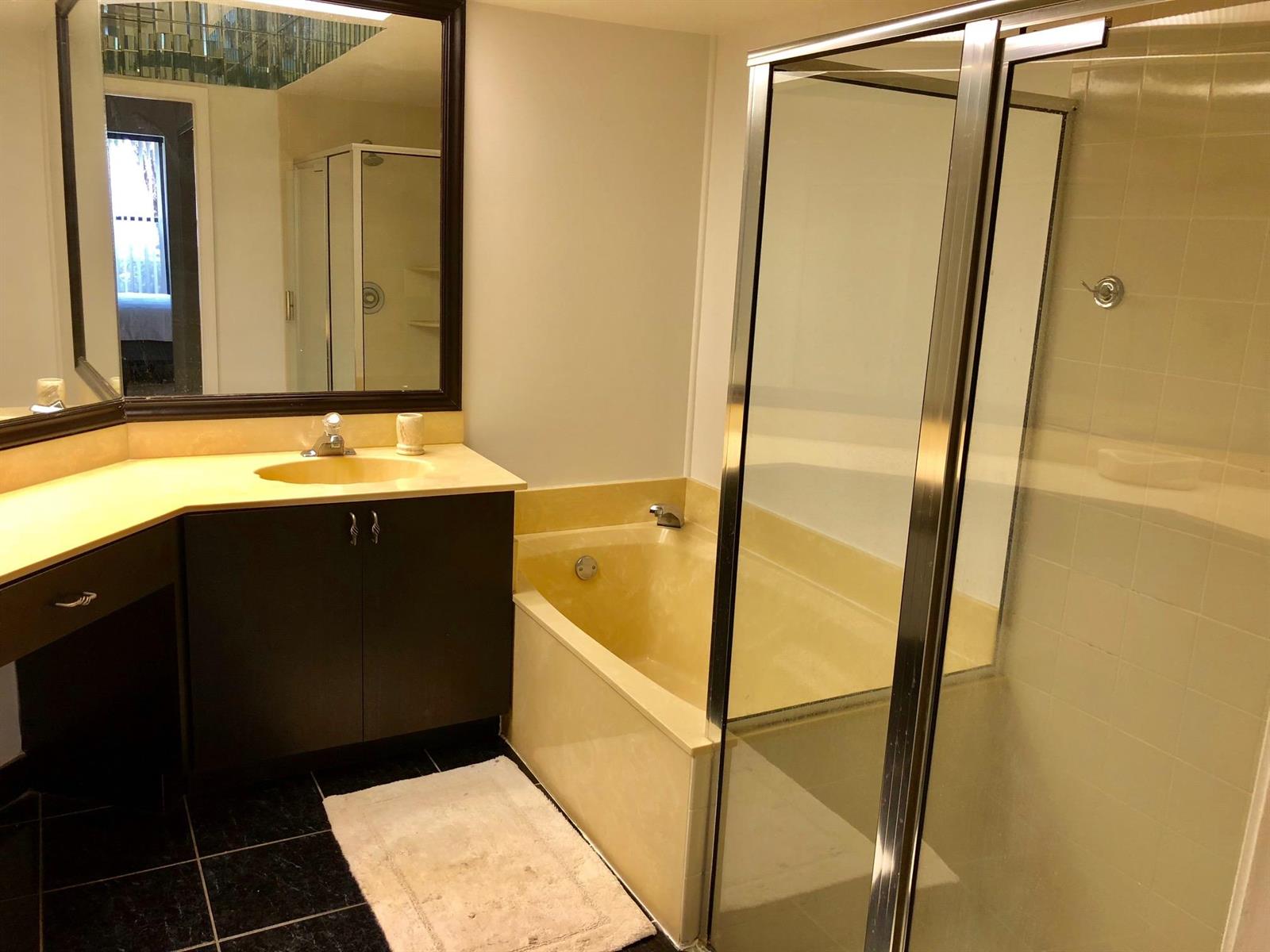 5801 Coach House Circle, Unit D Boca Raton, FL 33486 - Photo 20 of 34 Master Bath