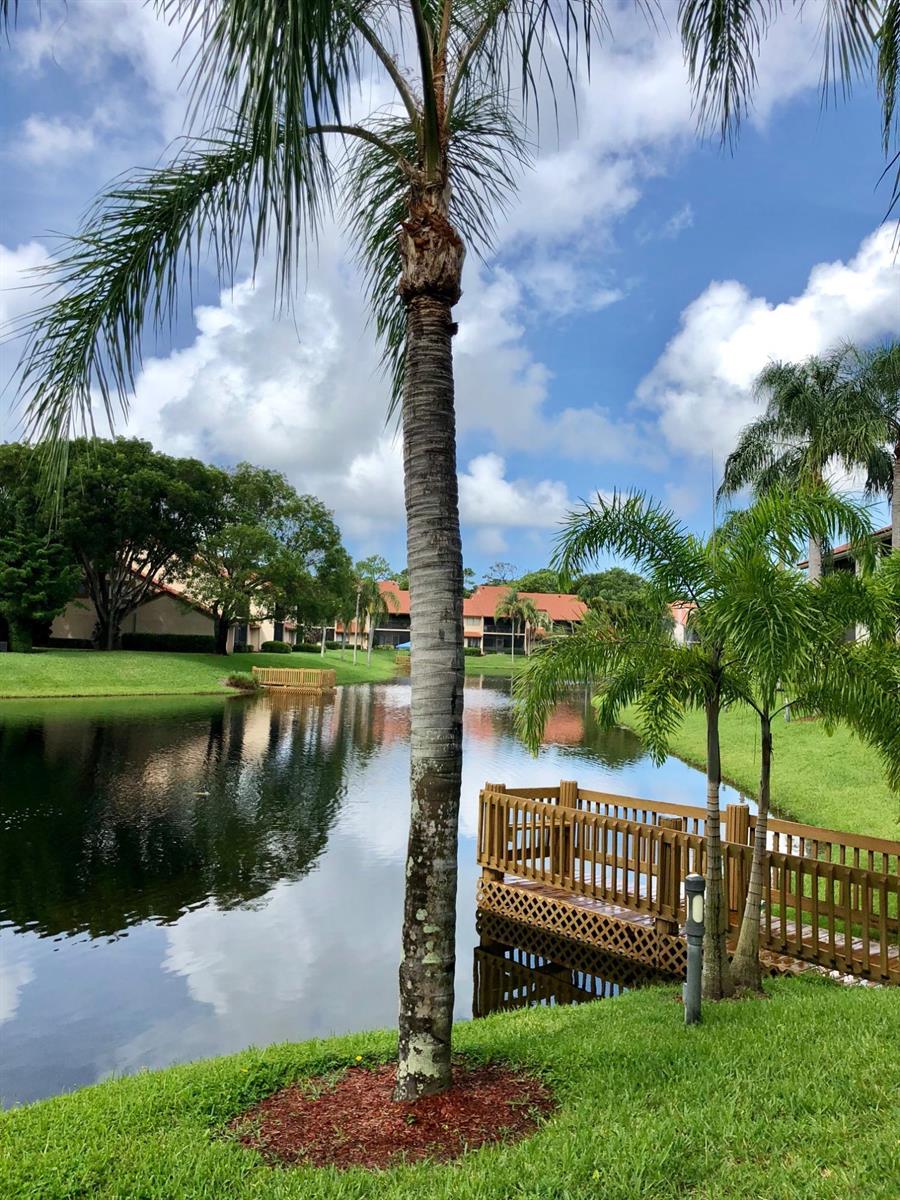 5801 Coach House Circle, Unit D Boca Raton, FL 33486 - Photo 29 of 34 Lake view