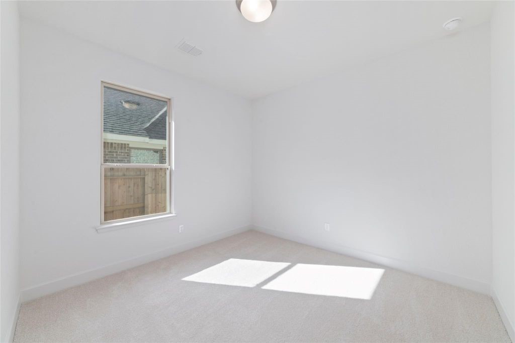 1434 Girasol Street Magnolia, TX 77354 - Photo 11 of 22 an empty room with a window