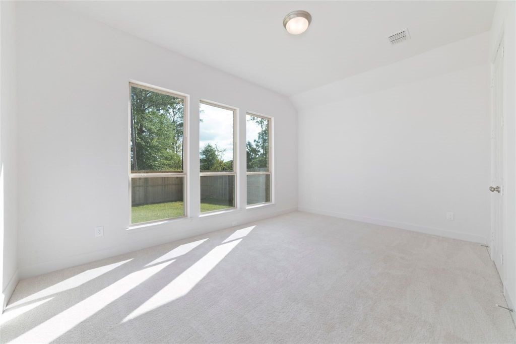 1434 Girasol Street Magnolia, TX 77354 - Photo 19 of 22 a view of an empty room with a window