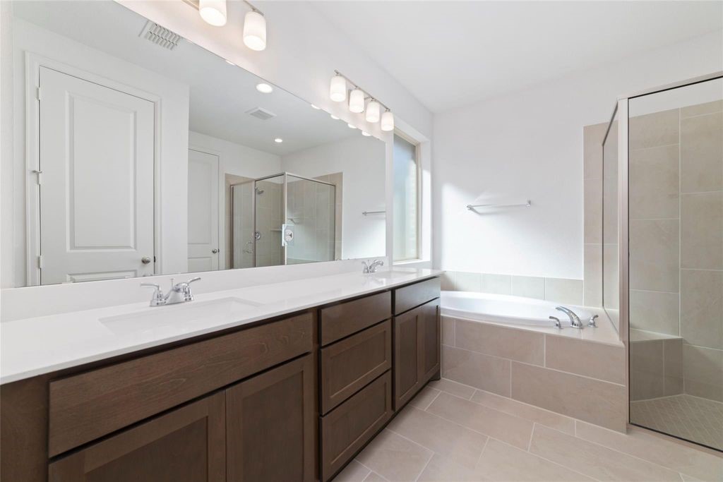 1434 Girasol Street Magnolia, TX 77354 - Photo 21 of 22 a spacious bathroom with a bathtub shower sink double and mirror